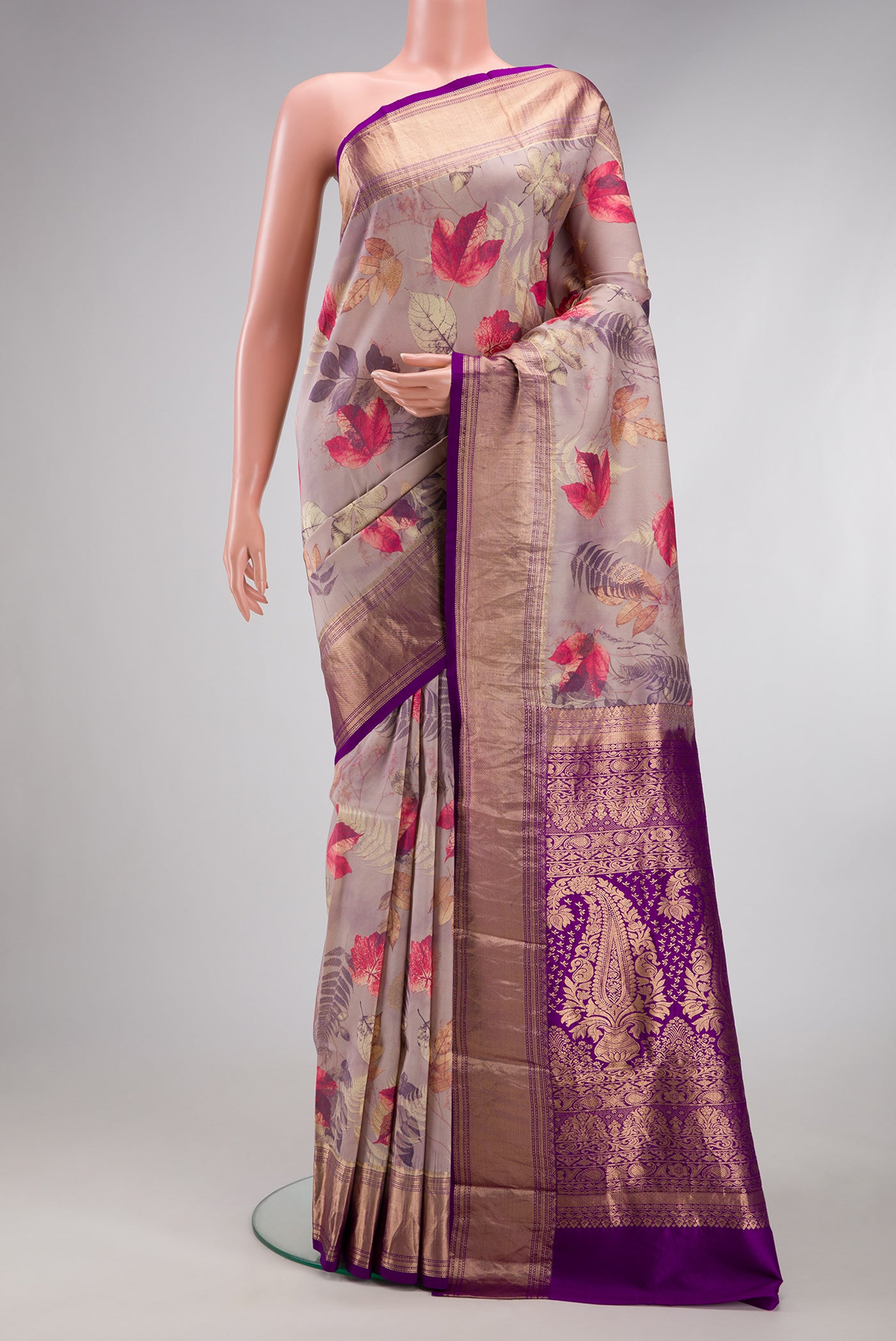 Rose Gold Kanjivaram Silk Saree with Floral Print on the body and Zari Border.  displayed on a mannequin