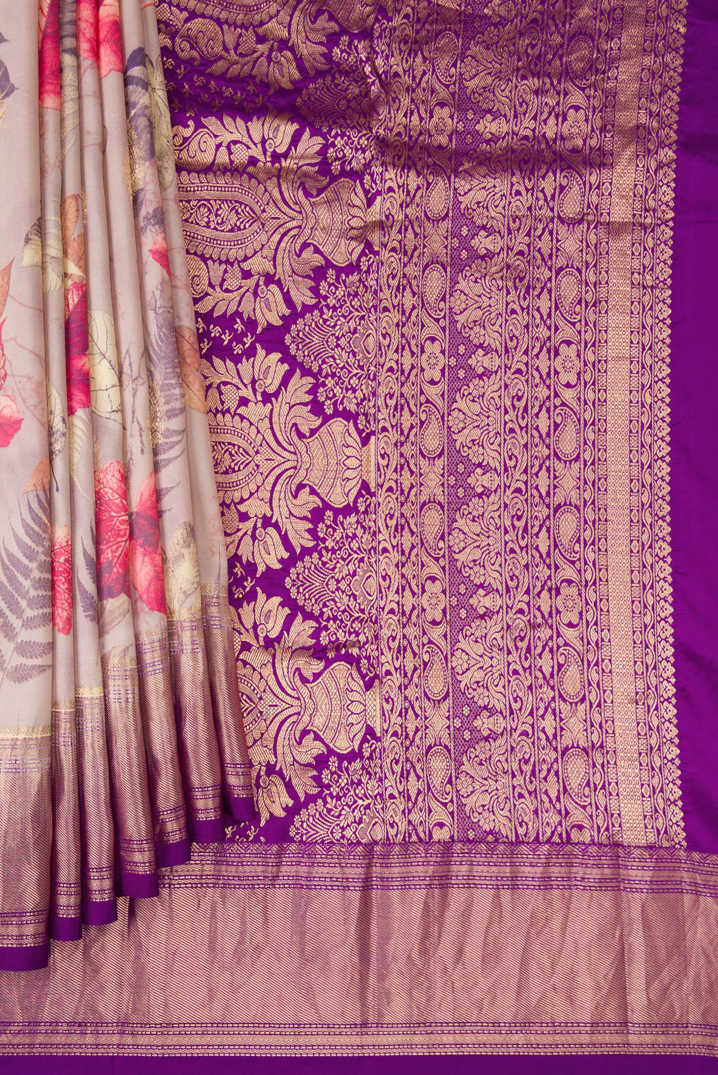 Pleats and pallu of Rose Gold Kanjivaram Silk Saree with Floral Print on the body and Zari Border. 