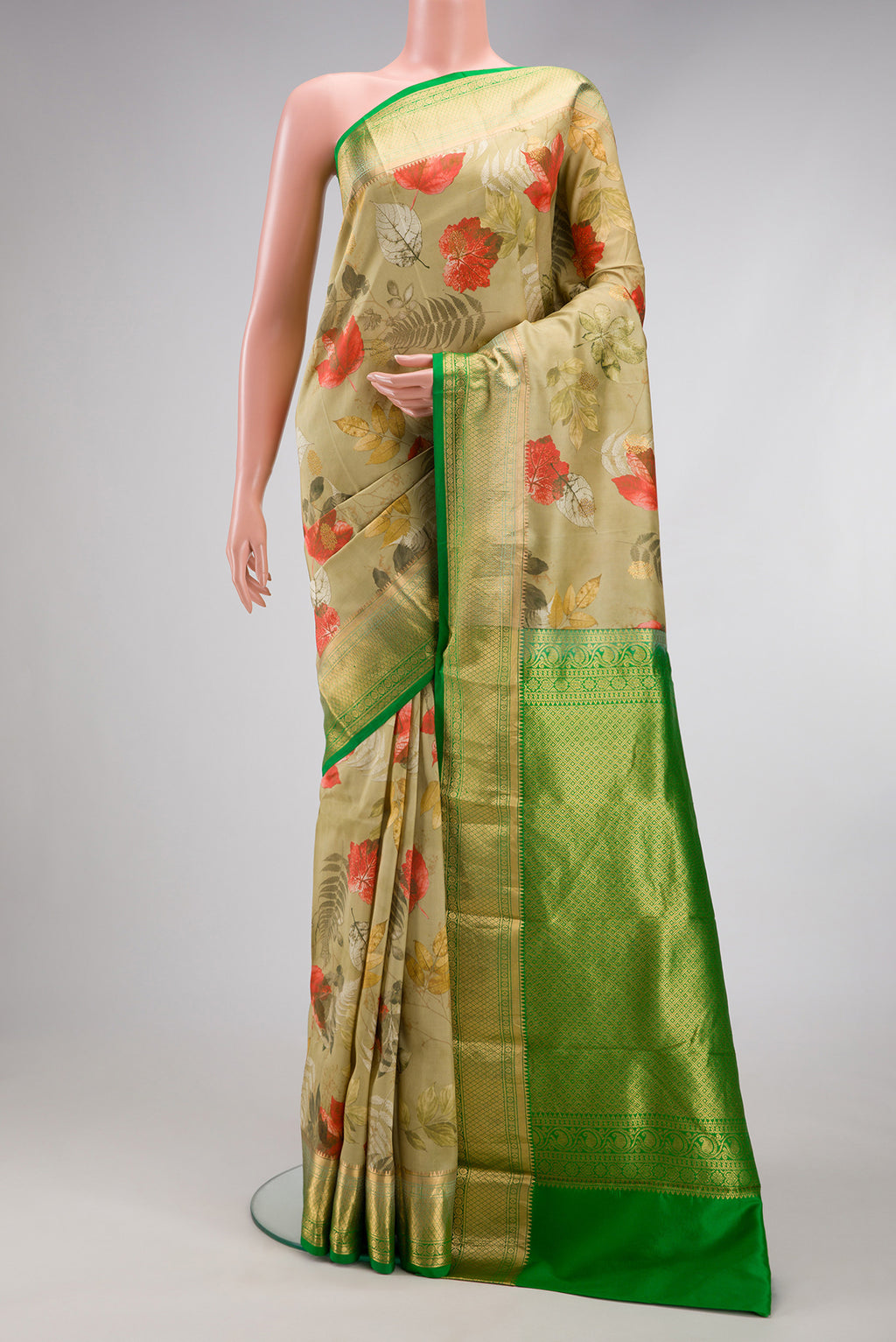 Light Green Kanjivaram Silk Saree with Floral Print on the body and Plain Border.  displayed on a mannequin