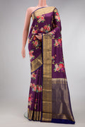 Purple Kanchipuram Silk Saree with Floral Print on the body and Zari Border.  displayed on a mannequin