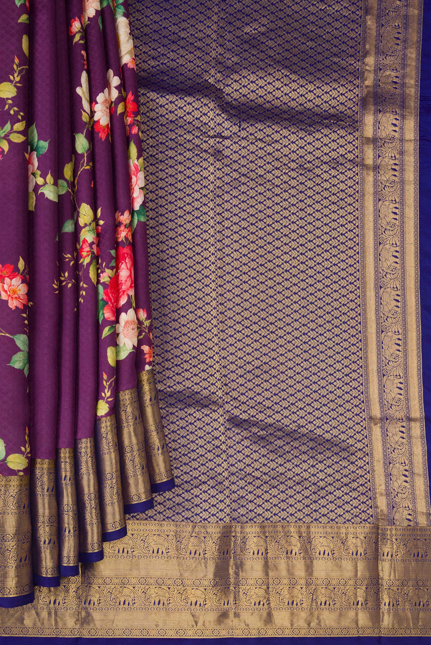 Pleats and pallu of Purple Kanchipuram Silk Saree with Floral Print on the body and Zari Border. 