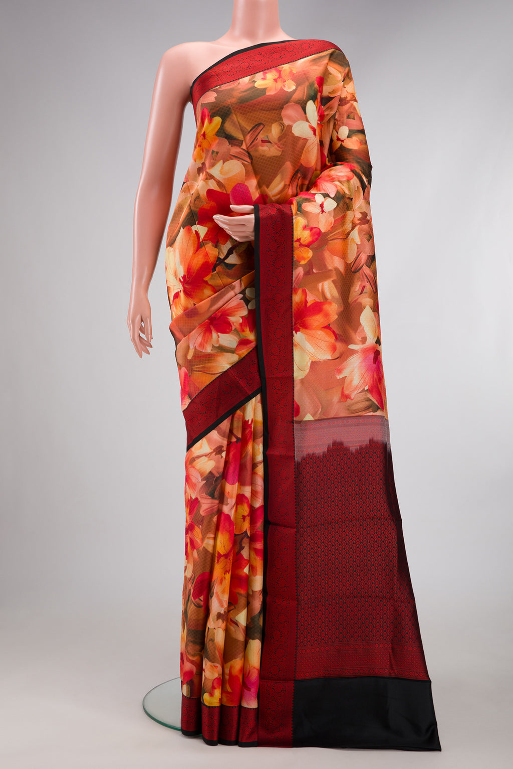 Multi Color Kanchipuram Silk Saree with Floral Print on the body and Thread Border.  displayed on a mannequin