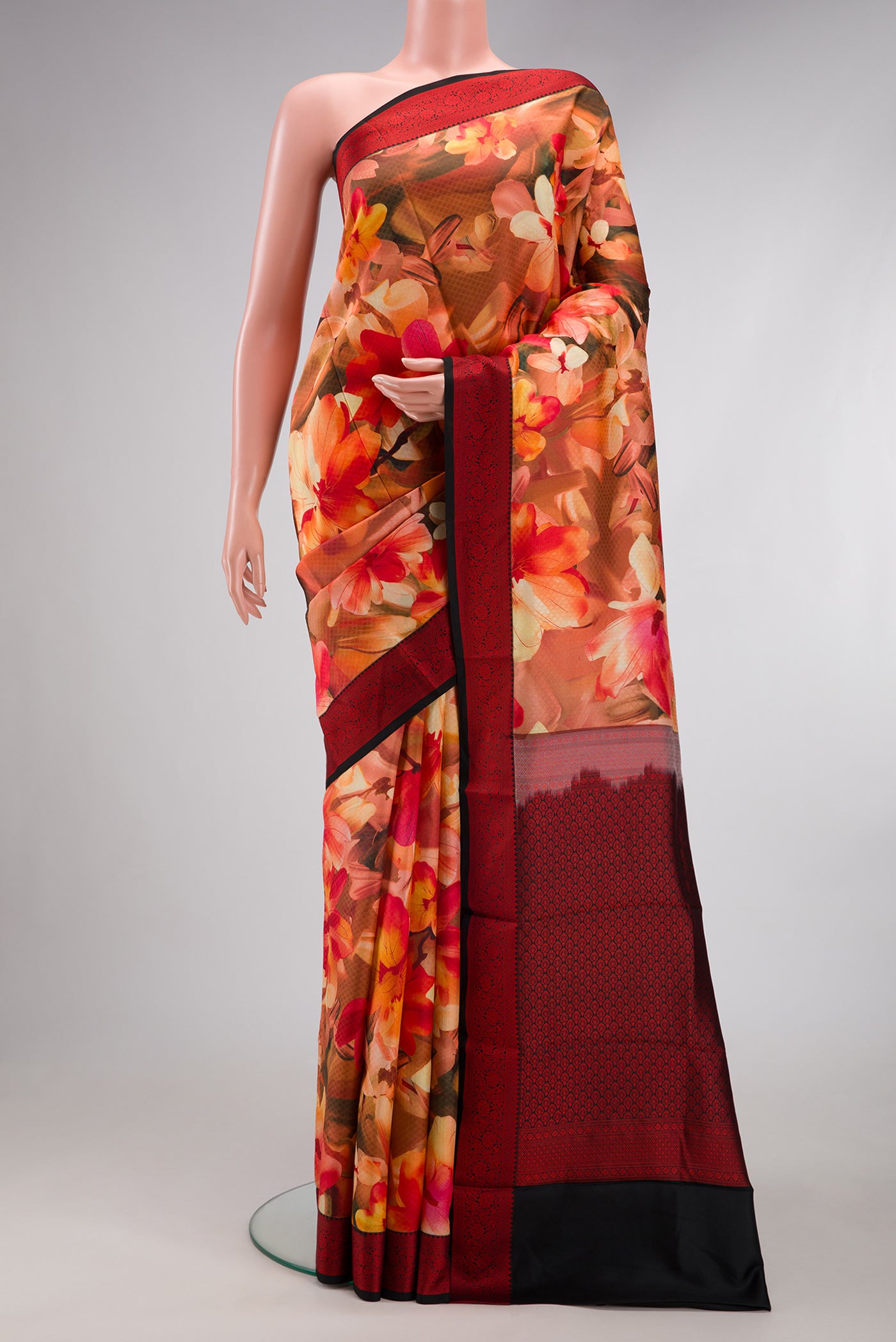 Multi Color Kanchipuram Silk Saree with Floral Print on the body and Thread Border.  displayed on a mannequin