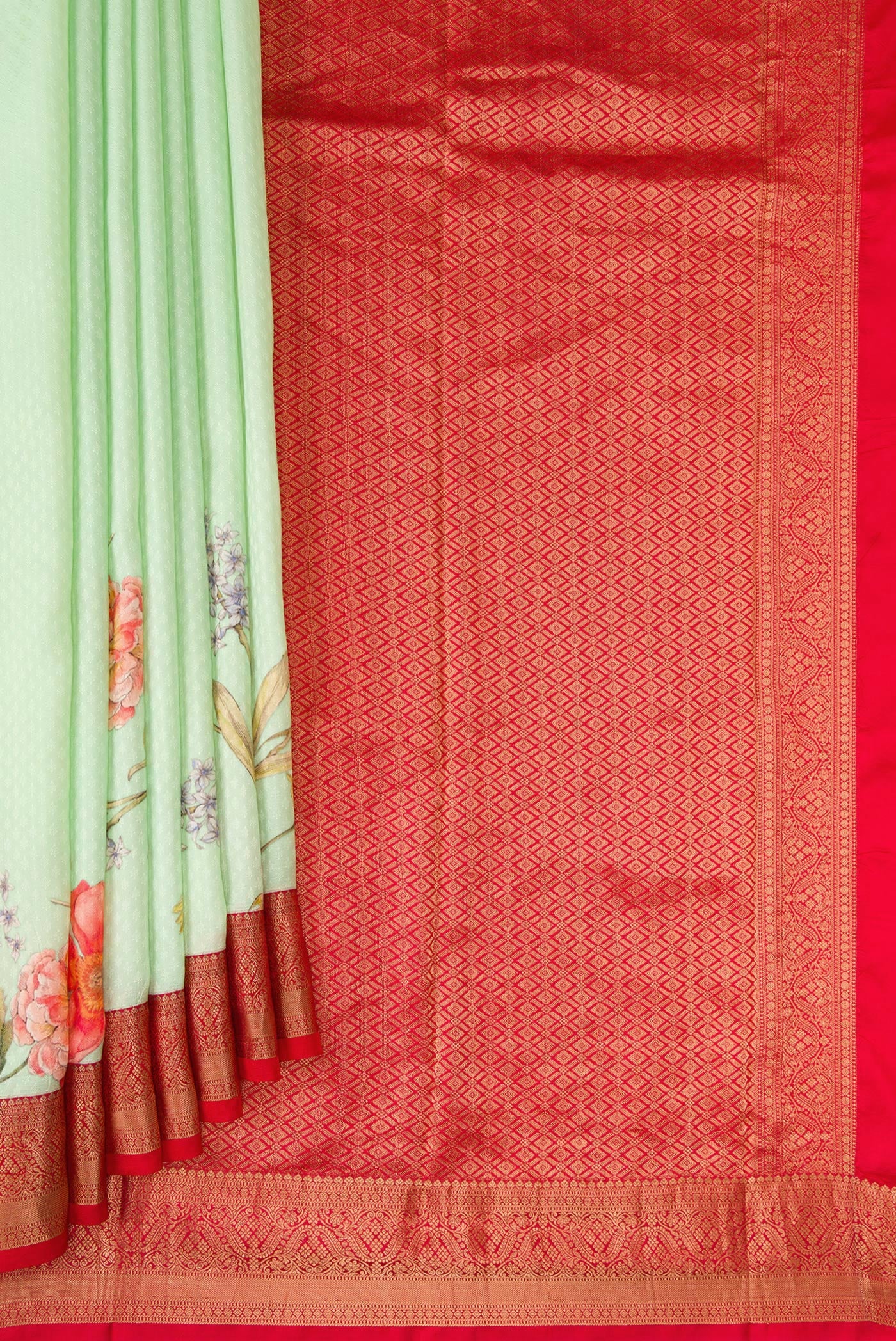 Pleats and pallu of Light Green Dual Tone Kanchipuram Silk Saree with Floral Print on the body and Zari Border. 