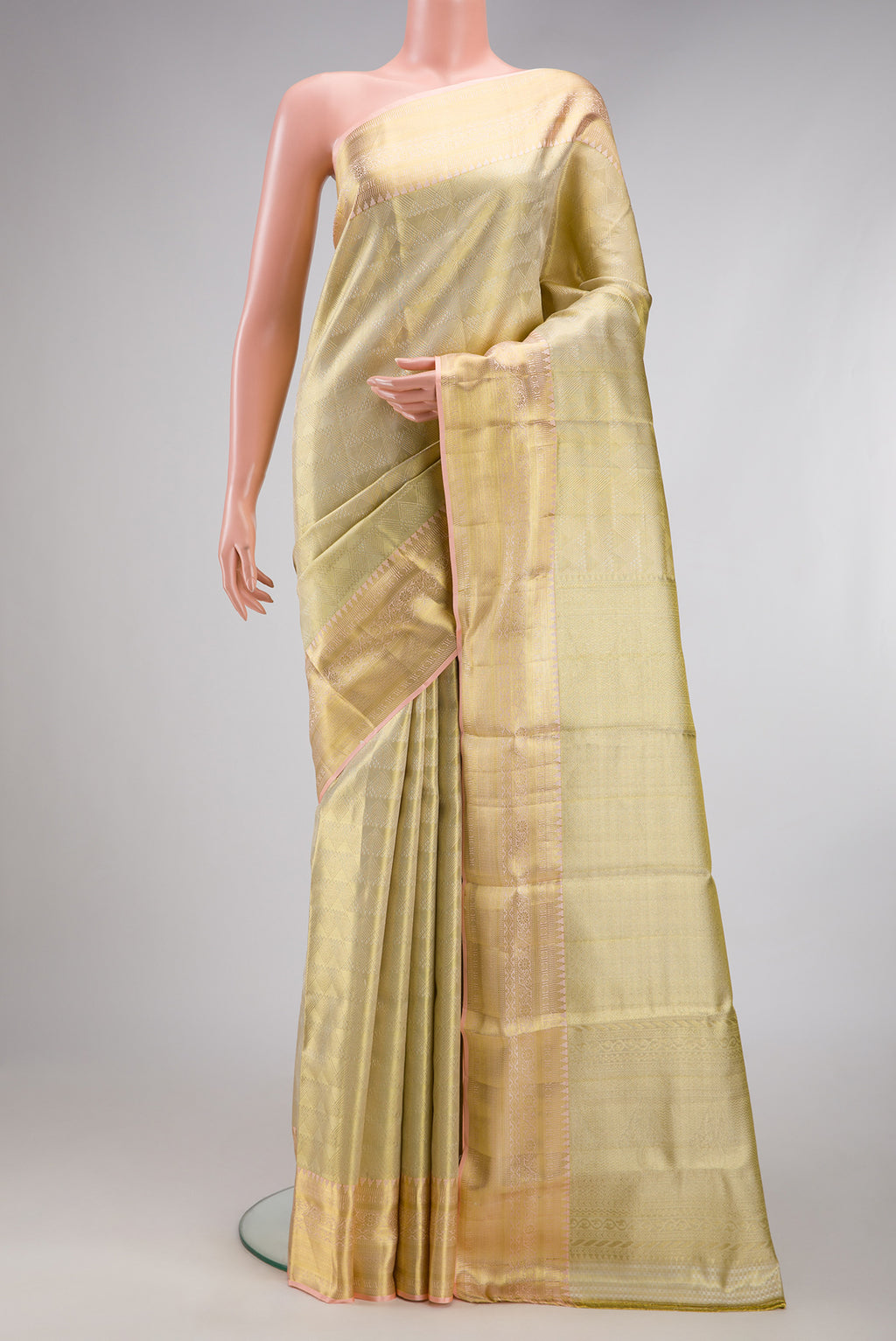 Gold Dual Tone Kanchipuram Tissue Silk Saree with Zari Brocade on the body and Zari Border.  displayed on a mannequin
