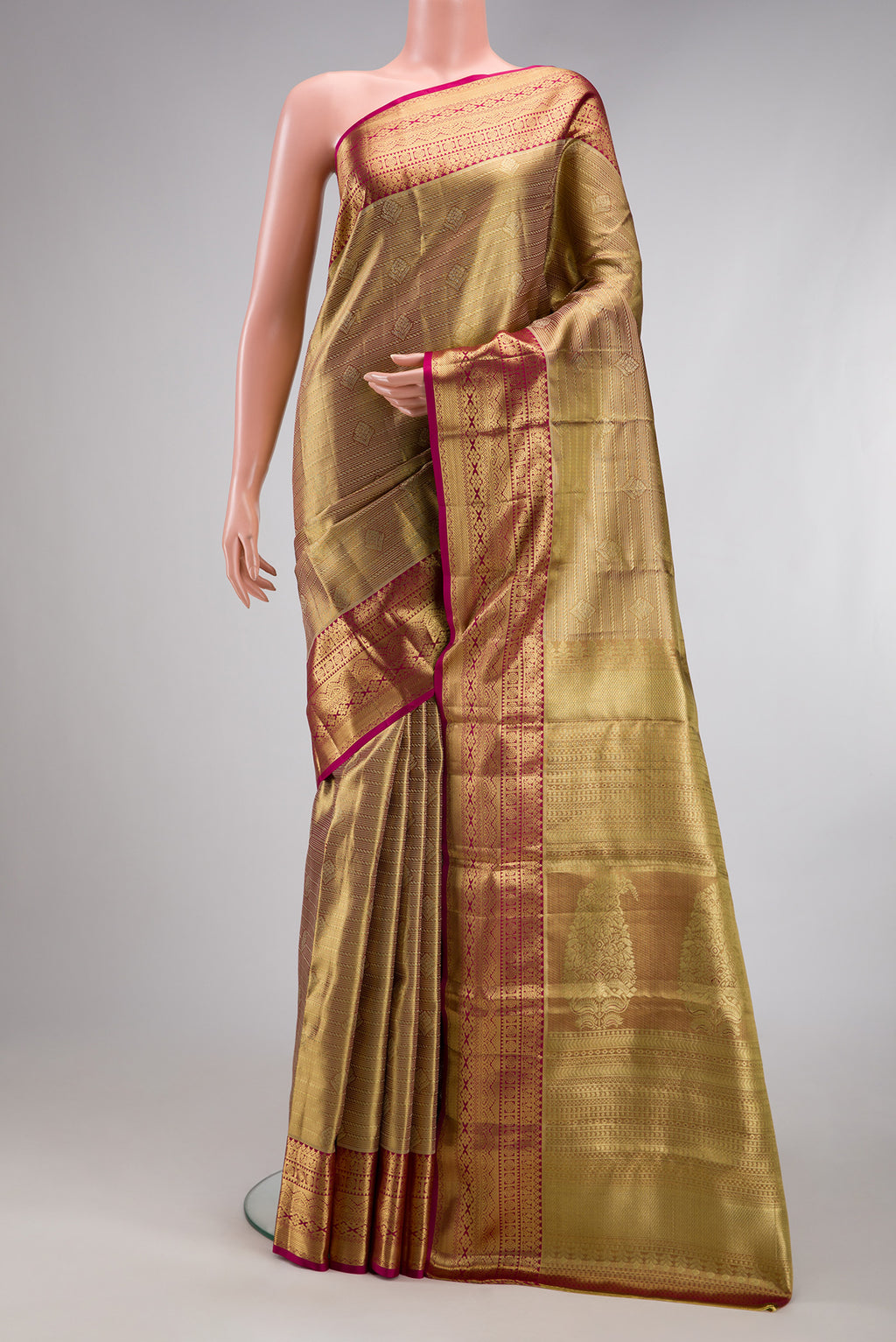 Gold Dual Tone Kanchipuram Tissue Silk Saree with Zari Brocade on the body and Zari Border.  displayed on a mannequin