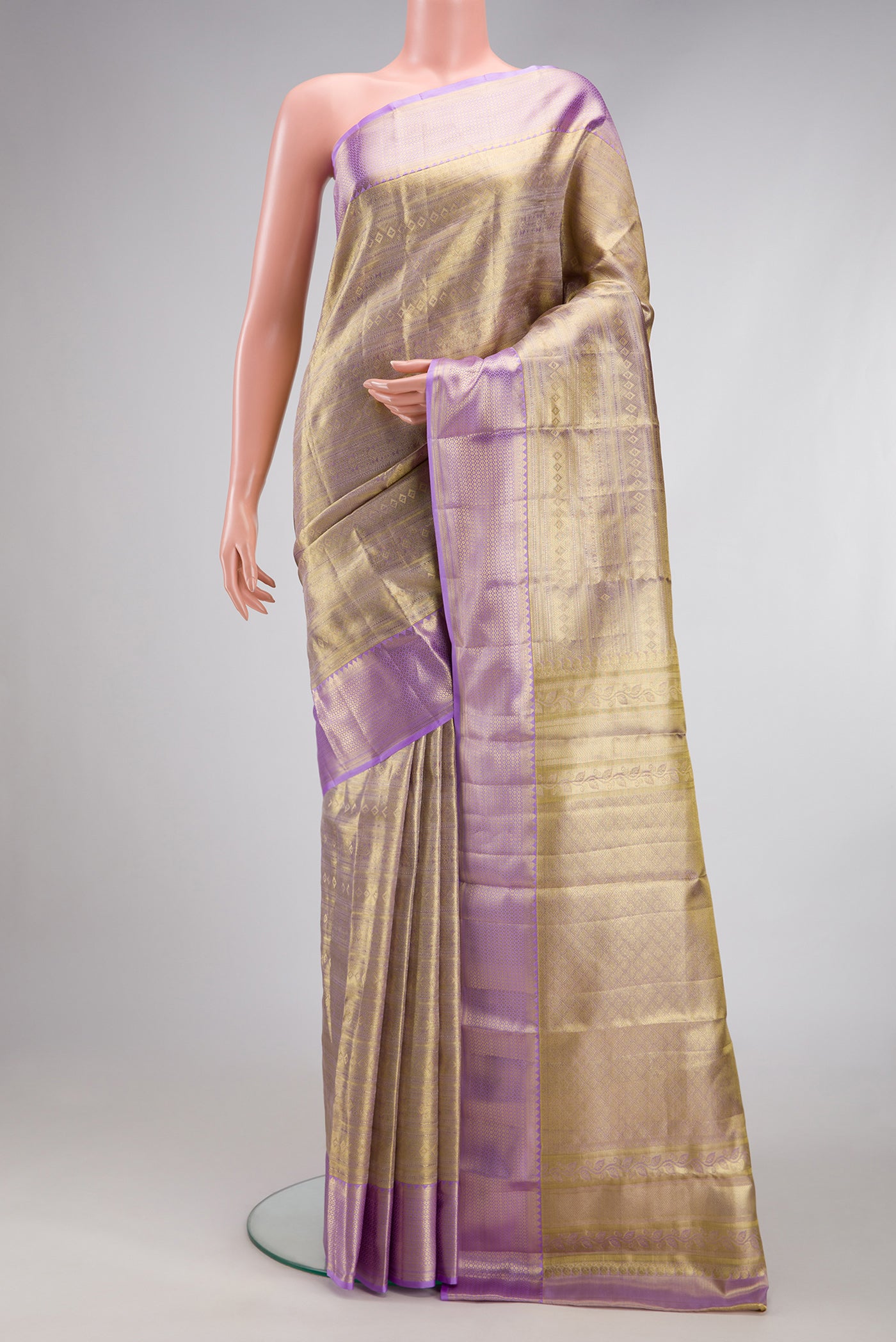 Gold Dual Tone Kanchipuram Tissue Silk Saree with Zari Brocade on the body and Zari Border.  displayed on a mannequin