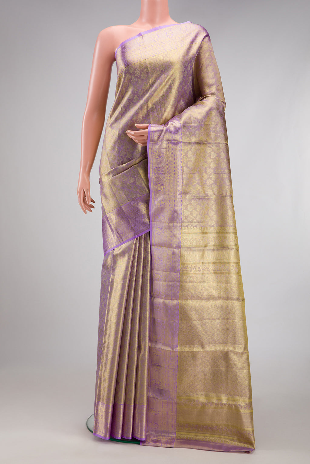 Lavender Dual Tone Kanchipuram Tissue Silk Saree with Zari Brocade on the body and Zari Border.  displayed on a mannequin