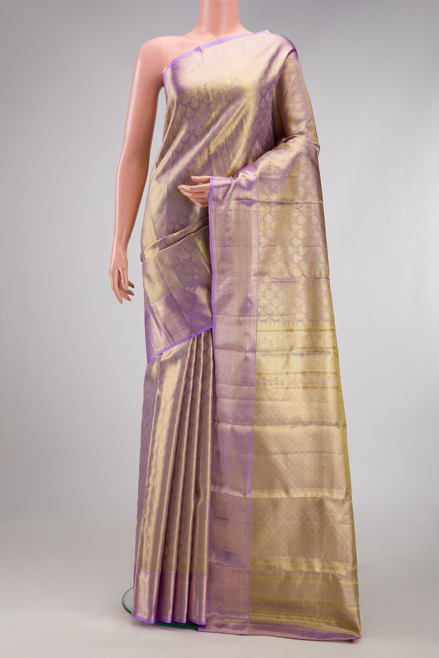 Lavender Dual Tone Kanchipuram Tissue Silk Saree with Zari Brocade on the body and Zari Border.  displayed on a mannequin
