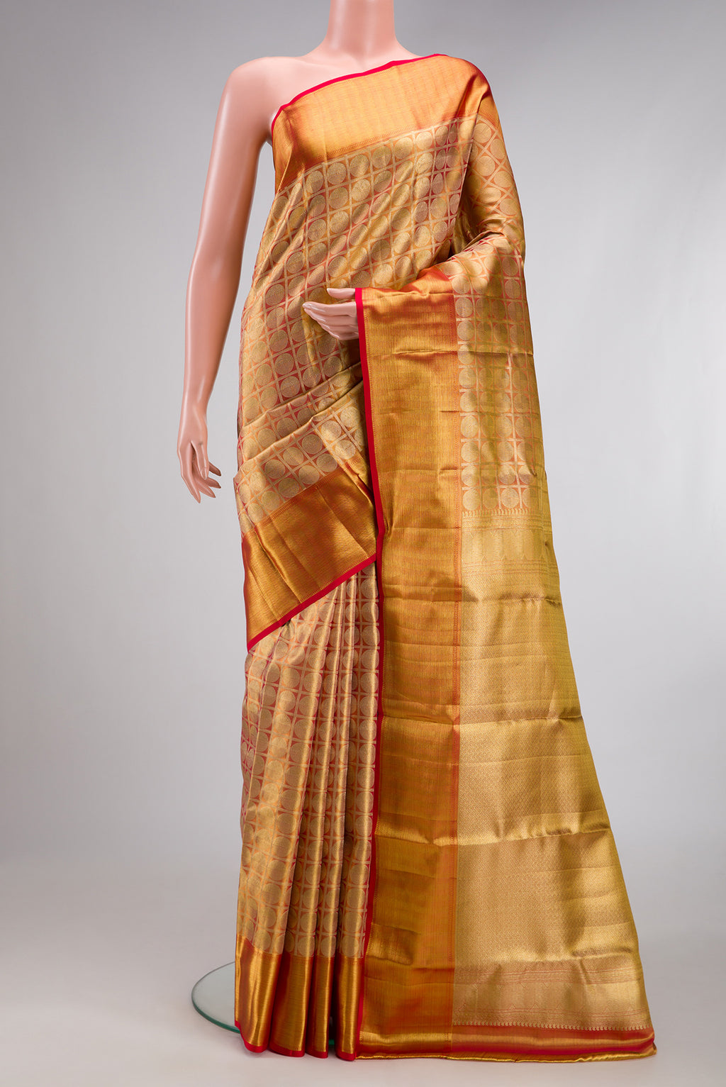 Gold Dual Tone Kanchipuram Tissue Silk Saree with Zari Brocade on the body and Zari Border.  displayed on a mannequin