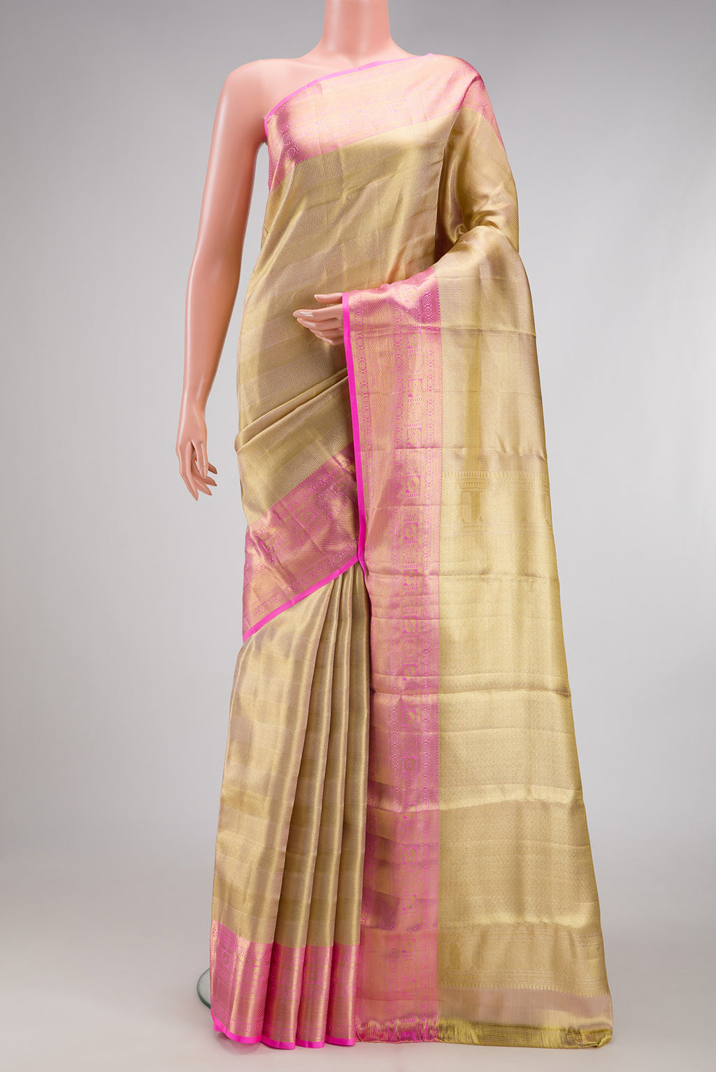 Gold Dual Tone Kanchipuram Tissue Silk Saree with Zari Brocade on the body and Zari Border.  displayed on a mannequin