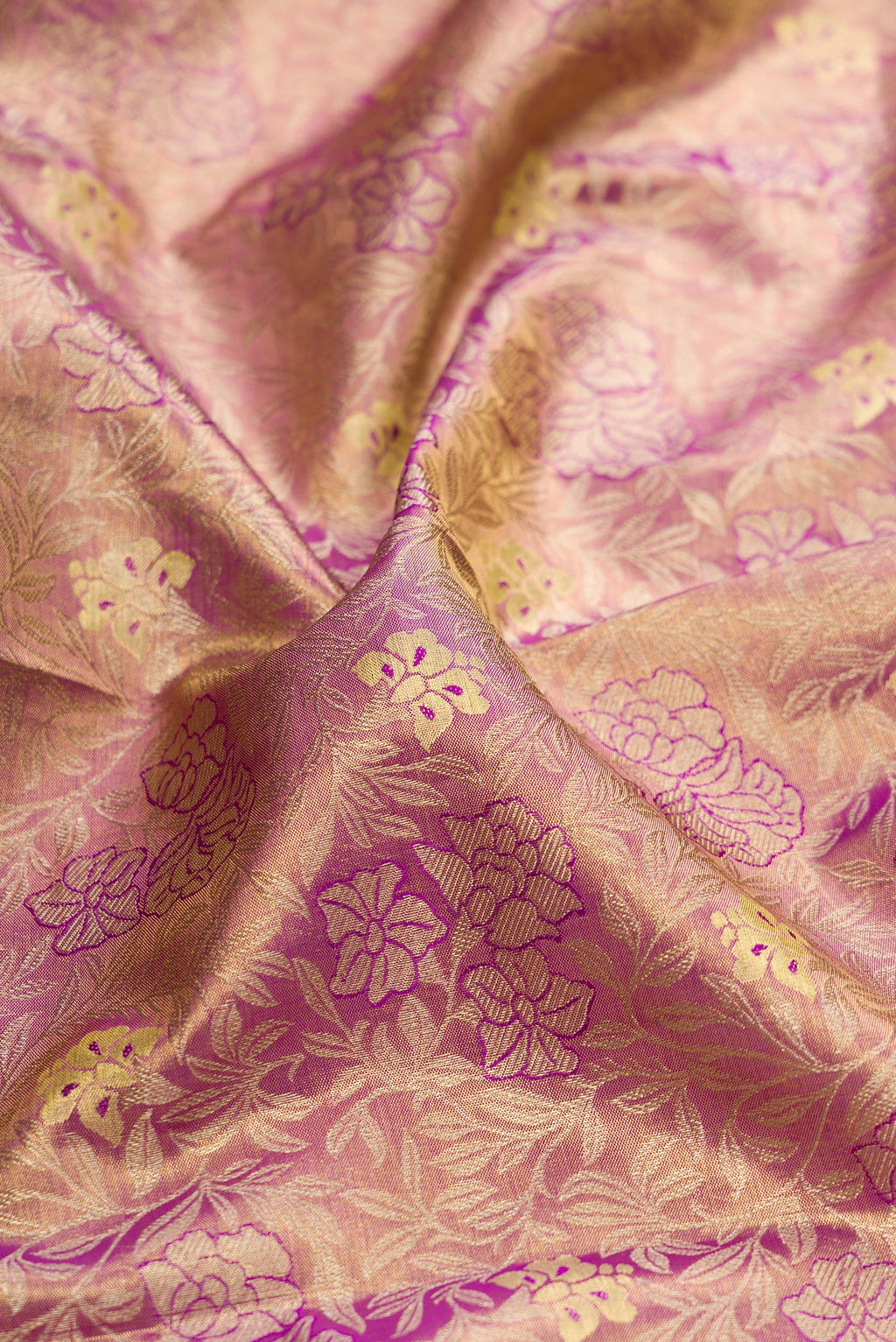 Close up of Purple Dual Tone Kanchipuram Tissue Silk Saree with Zari Brocade on the body and Zari Border.  displaying folds