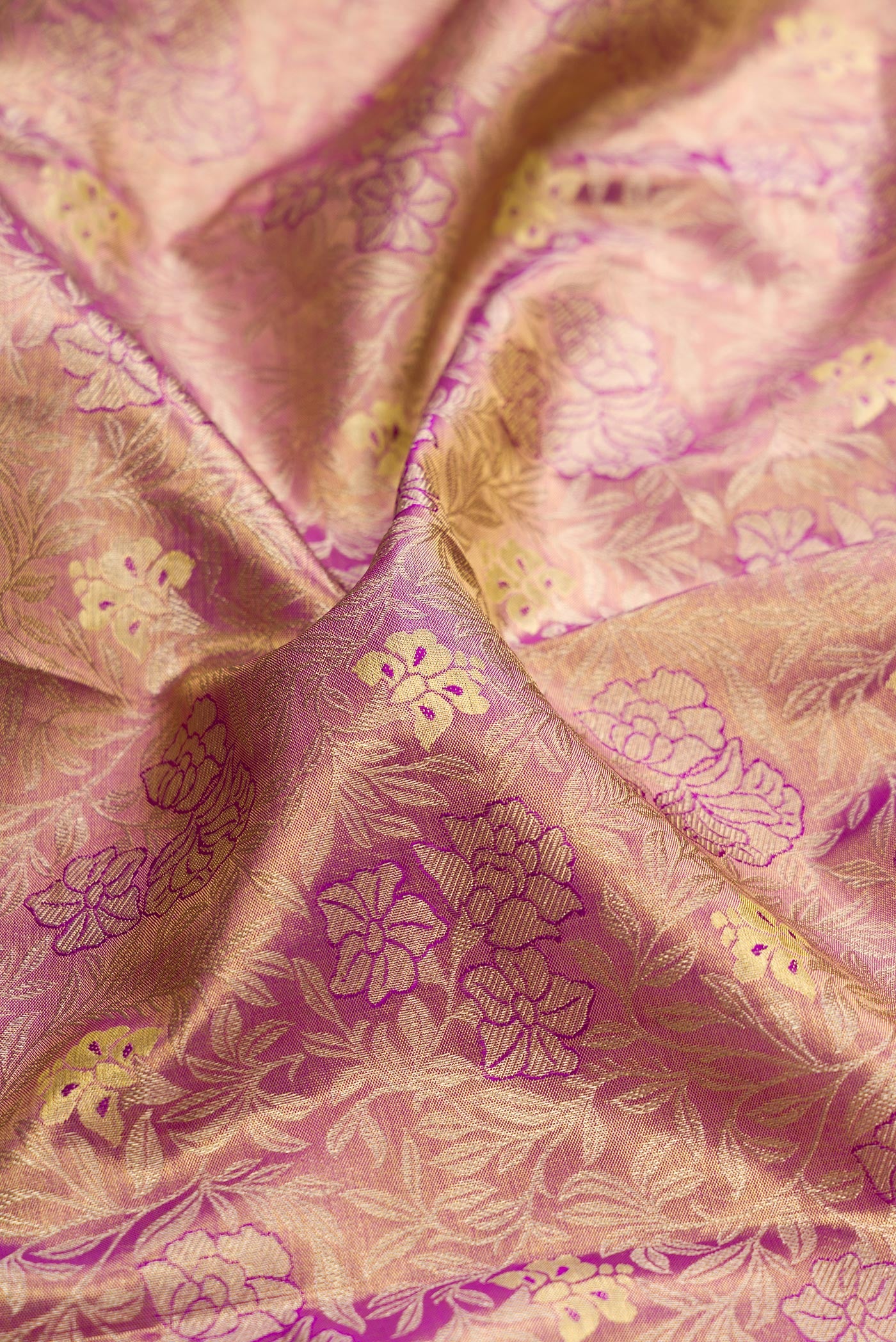 Close up of Purple Dual Tone Kanchipuram Tissue Silk Saree with Zari Brocade on the body and Zari Border.  displaying folds