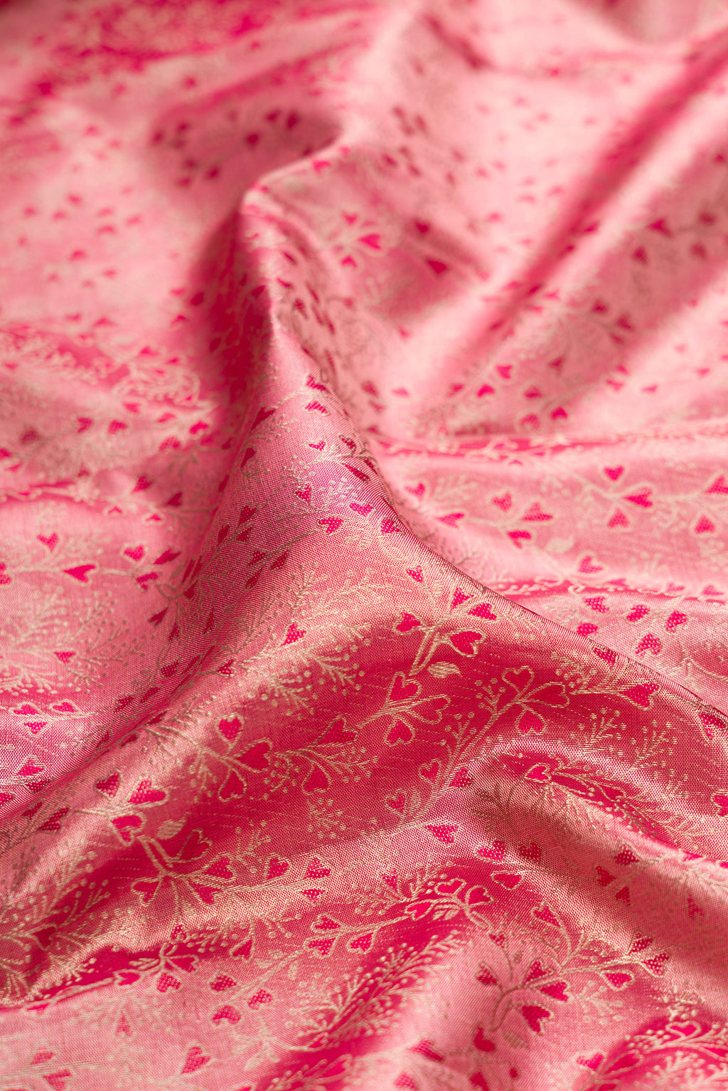 Close up of Pink Dual Tone Kanchipuram Tissue Silk Saree with Zari Brocade on the body and Fancy Border.  displaying folds