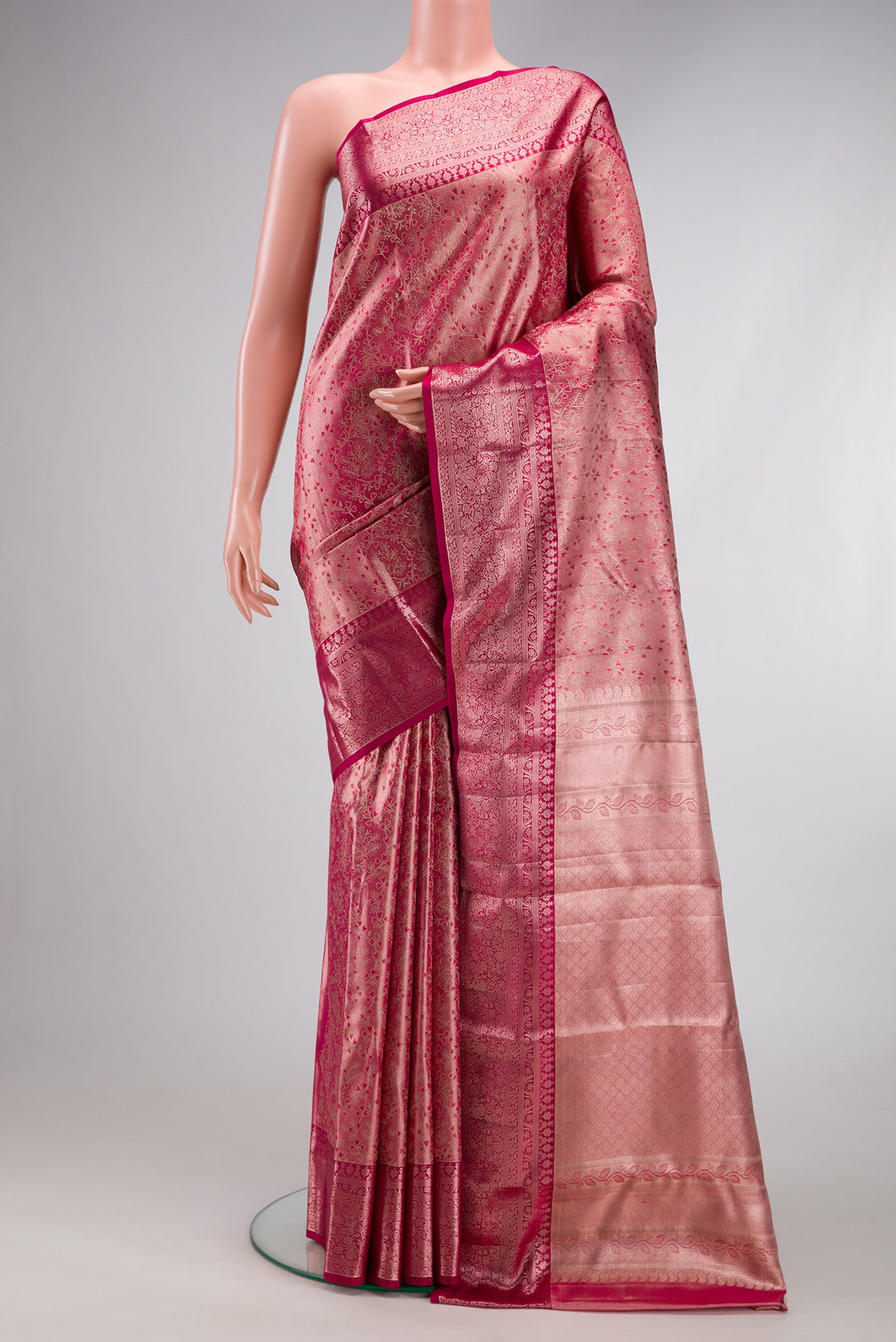 Pink Dual Tone Kanchipuram Tissue Silk Saree with Zari Brocade on the body and Fancy Border.  displayed on a mannequin