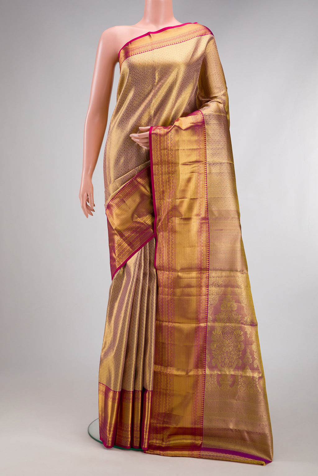 Gold Dual Tone Kanchipuram Tissue Silk Saree with Zari Brocade on the body and Fancy Border.  displayed on a mannequin