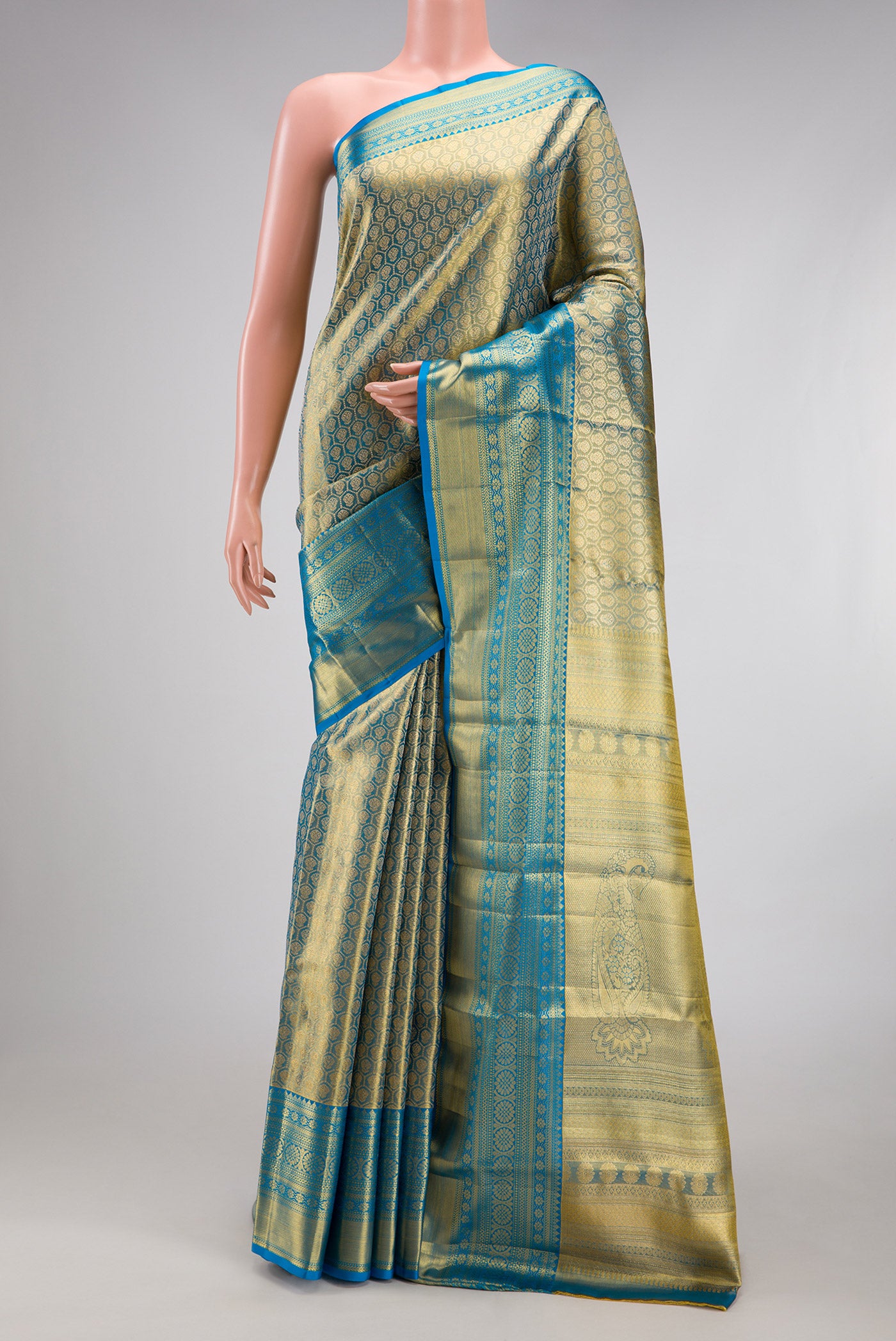 Light Blue Dual Tone Kanchipuram Tissue Silk Saree with Zari Brocade on the body and Zari Border.  displayed on a mannequin