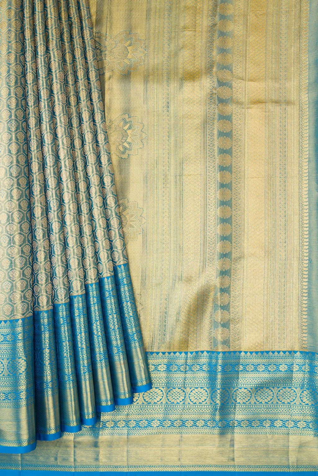 Pleats and pallu of Light Blue Dual Tone Kanchipuram Tissue Silk Saree with Zari Brocade on the body and Zari Border. 