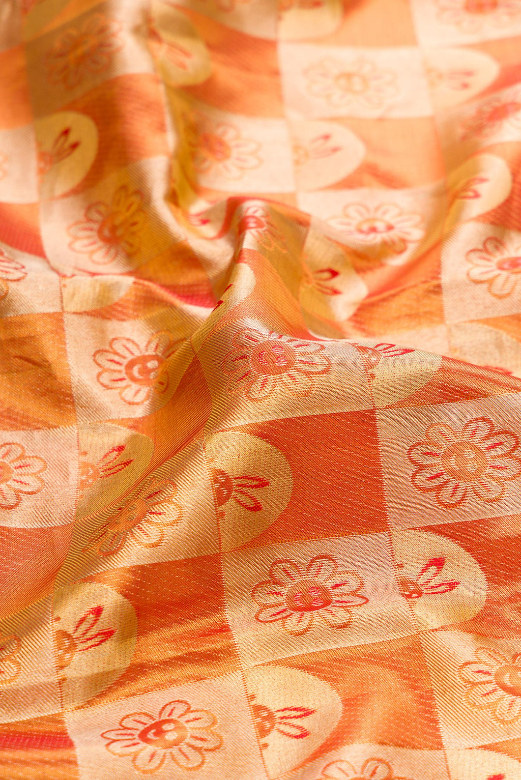 Close up of Gold Dual Tone Kanchipuram Tissue Silk Saree with Zari Brocade on the body and Zari Border.  displaying folds