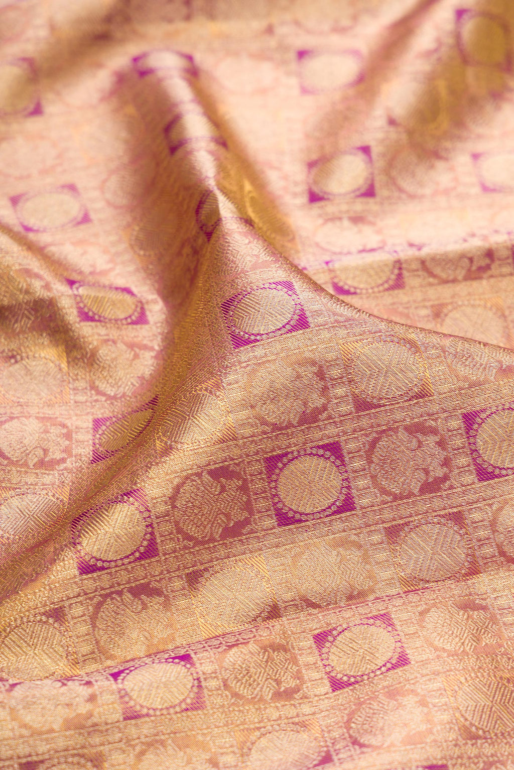 Close up of Purple Dual Tone Kanchipuram Tissue Silk Saree with Zari Brocade on the body and Zari Border.  displaying folds
