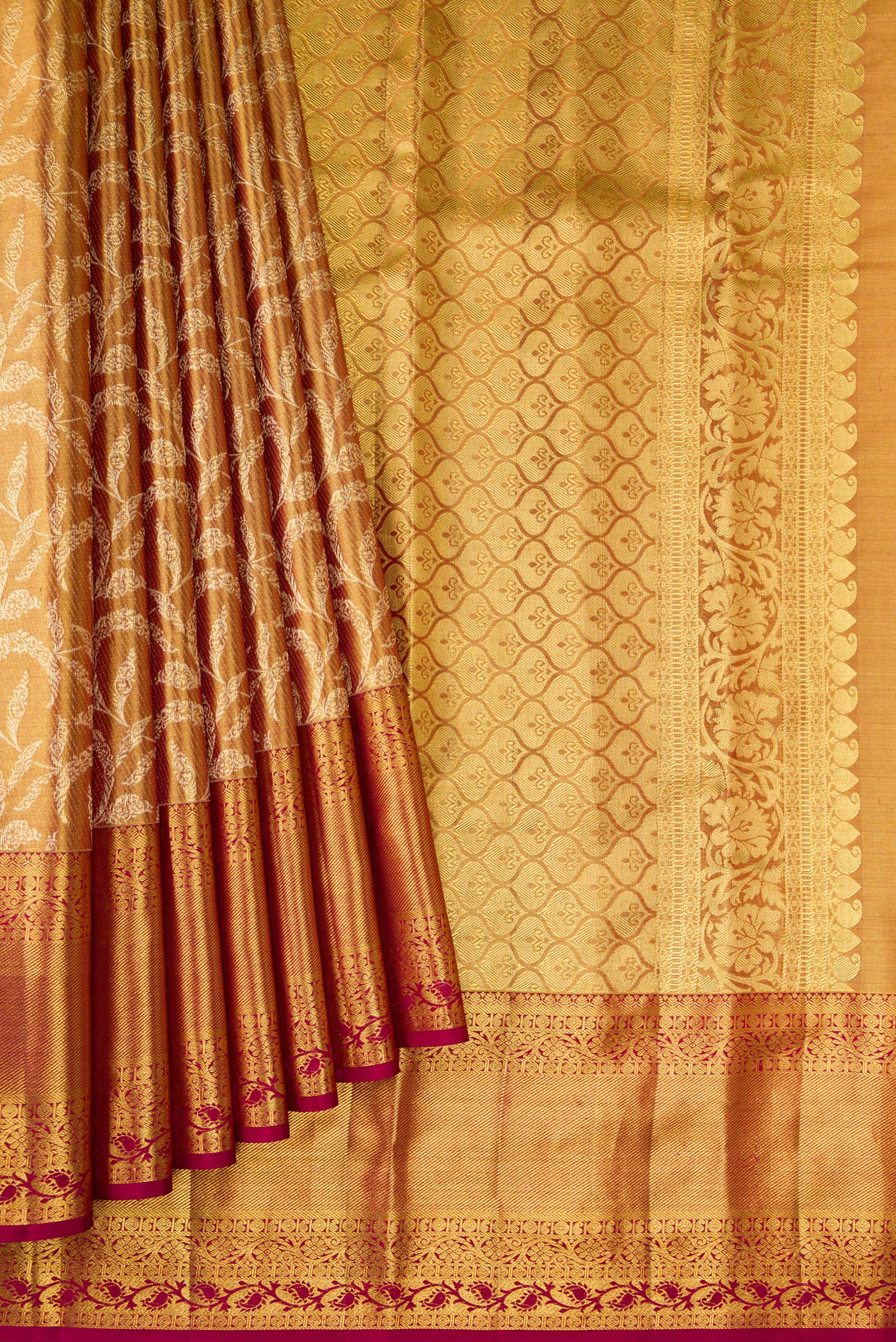 Pleats and pallu of Gold Dual Tone Kanchipuram Tissue Silk Saree with Zari Brocade on the body and Fancy Border. 