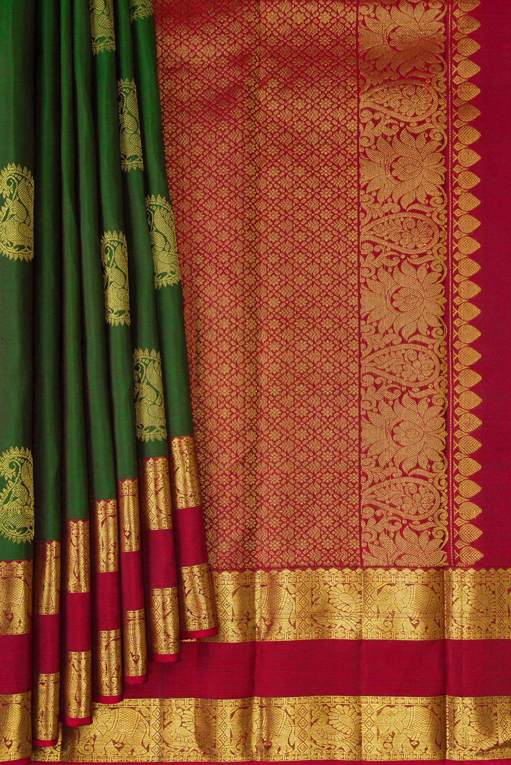 Pleats and pallu of Bottle Green Kanjivaram Silk Saree with Zari Butta on the body and Zari Border. 