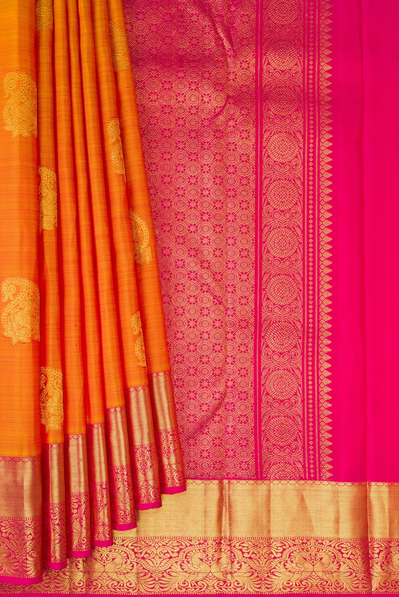 Pleats and pallu of Mustard Kanjivaram Silk Saree with Zari Butta on the body and Zari Border. 