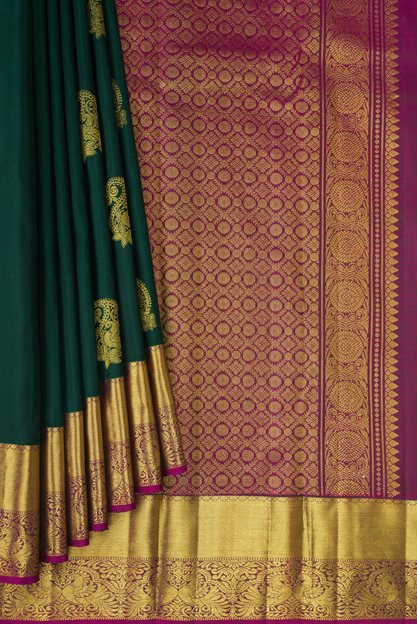 Pleats and pallu of Bottle Green Kanjivaram Silk Saree with Zari Butta on the body and Zari Border. 