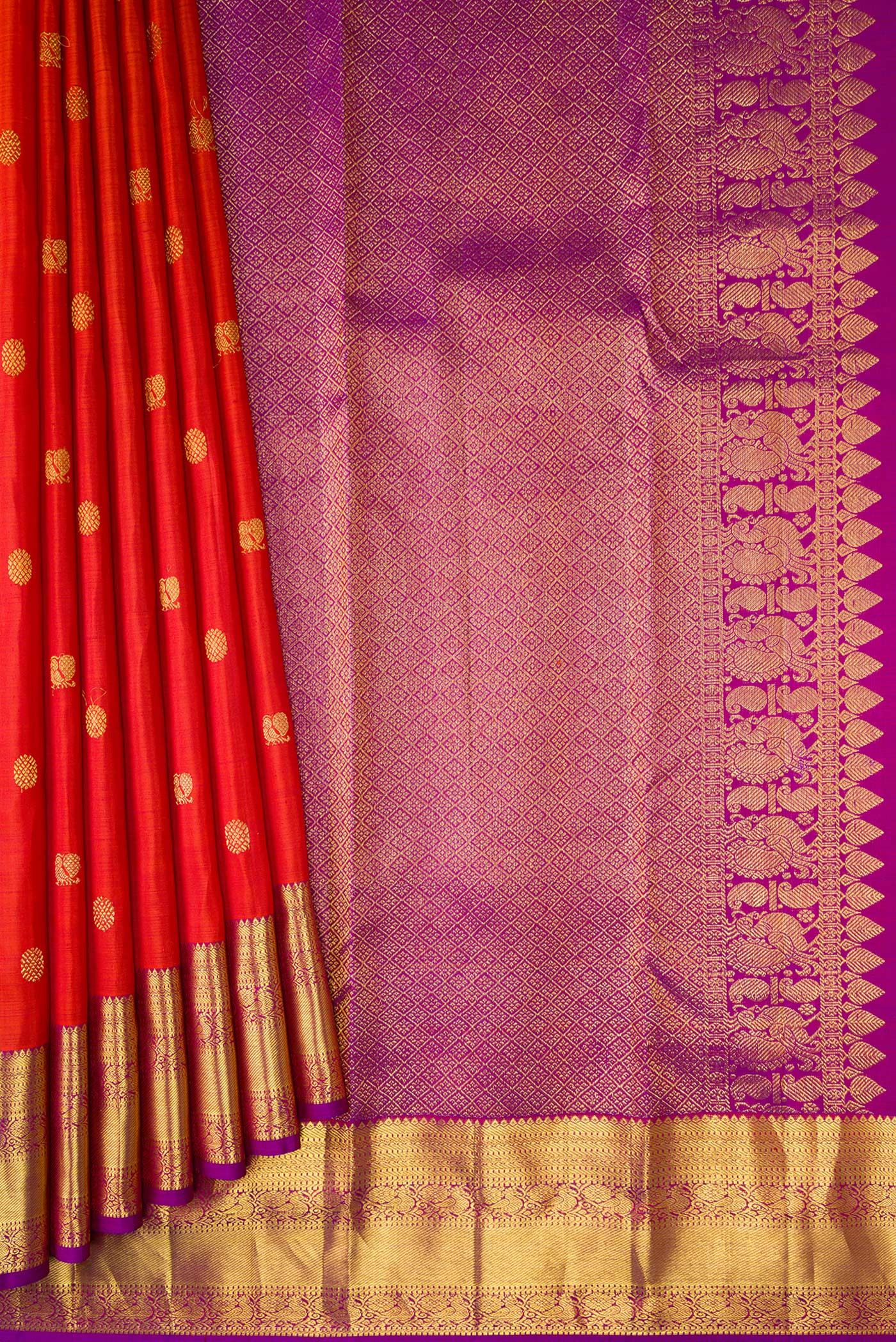 Pleats and pallu of Orange Kanjivaram Silk Saree with Zari Butta on the body and Zari Border. 