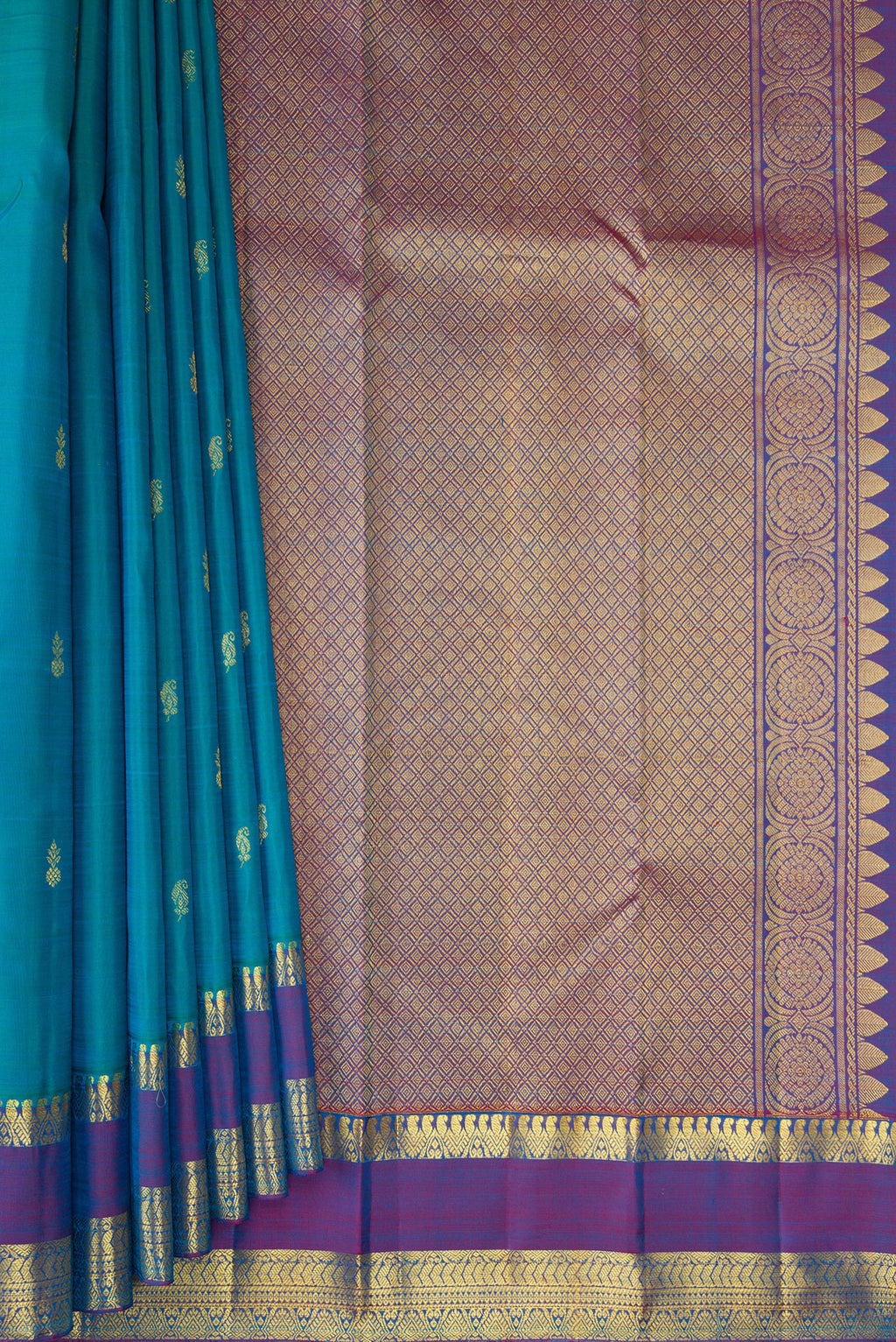 Pleats and pallu of Peacock Blue Kanjivaram Silk Saree with Zari Butta on the body and Zari Border. 
