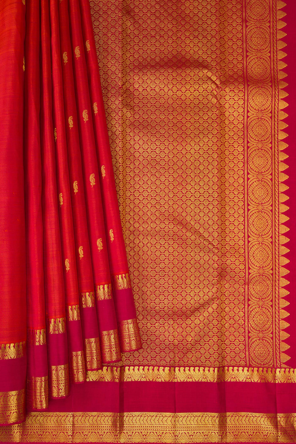 Pleats and pallu of Brick Orange Kanjivaram Silk Saree with Zari Butta on the body and Zari Border. 