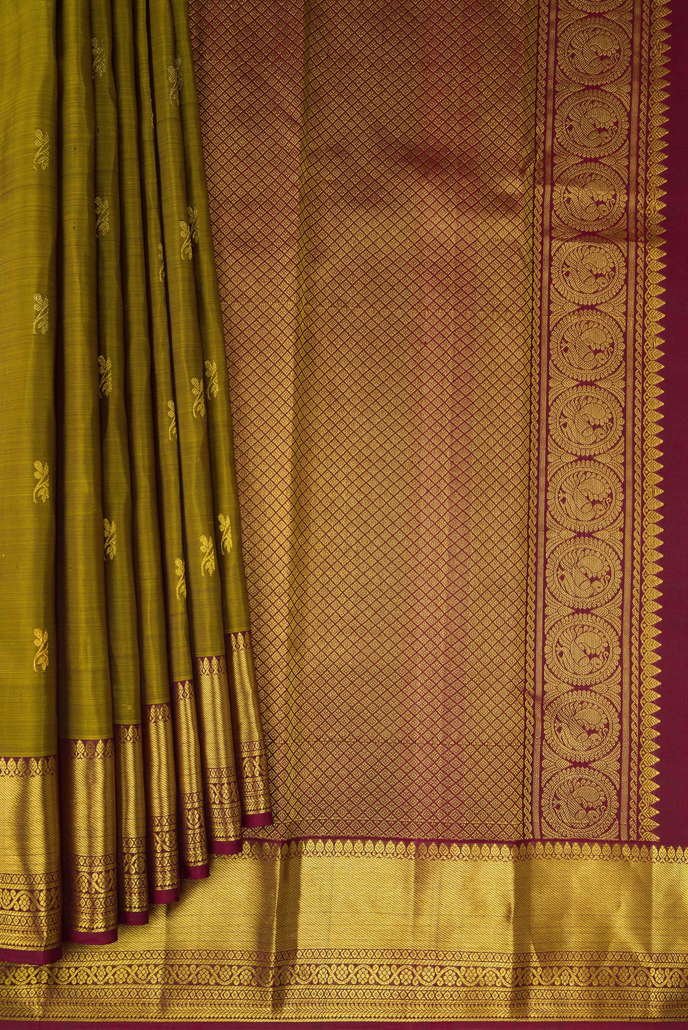 Pleats and pallu of Mehandi Green Kanjivaram Silk Saree with Zari Butta on the body and Zari Border. 