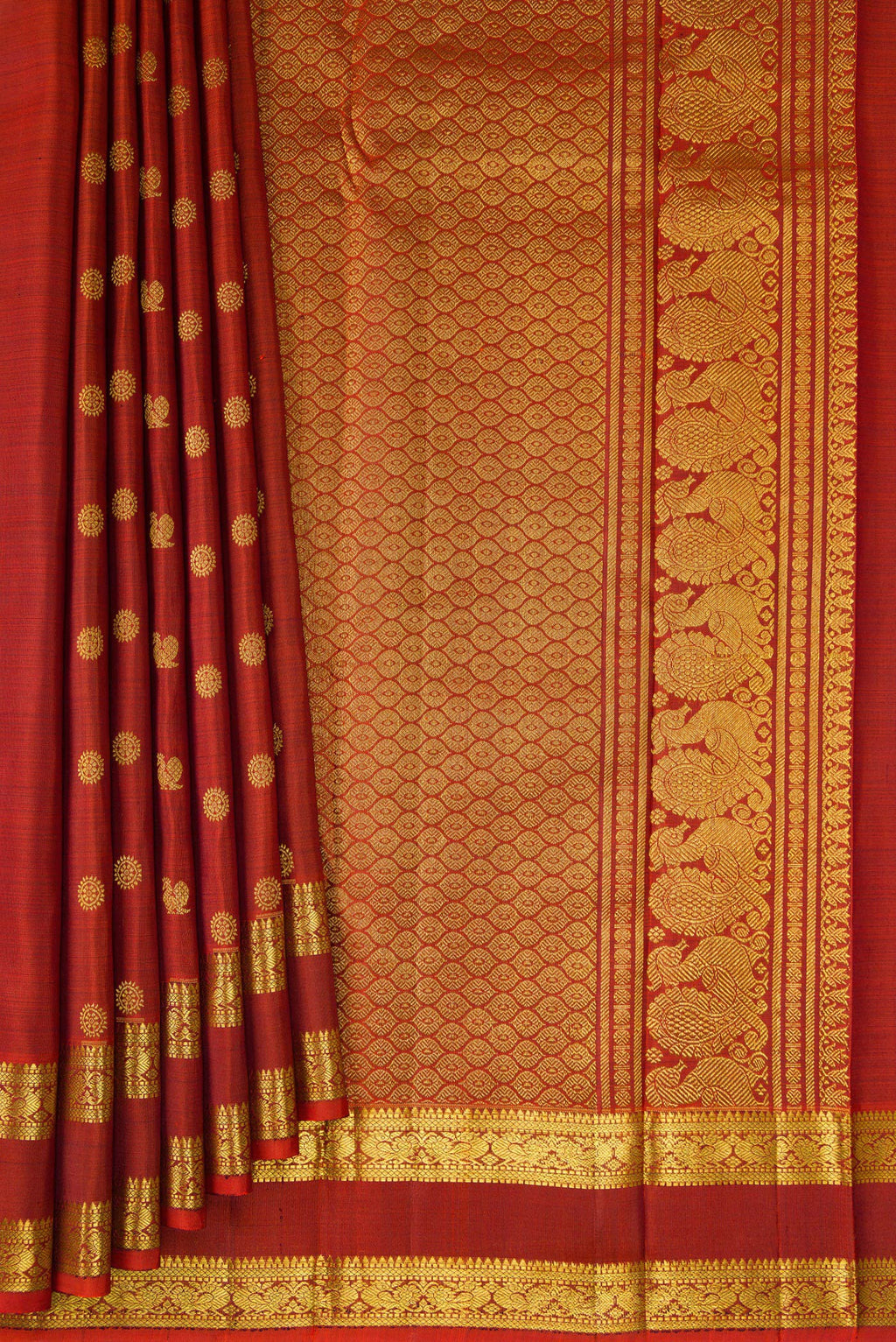 Pleats and pallu of Rust Kanjivaram Silk Saree with Zari Butta on the body and Zari Border. 