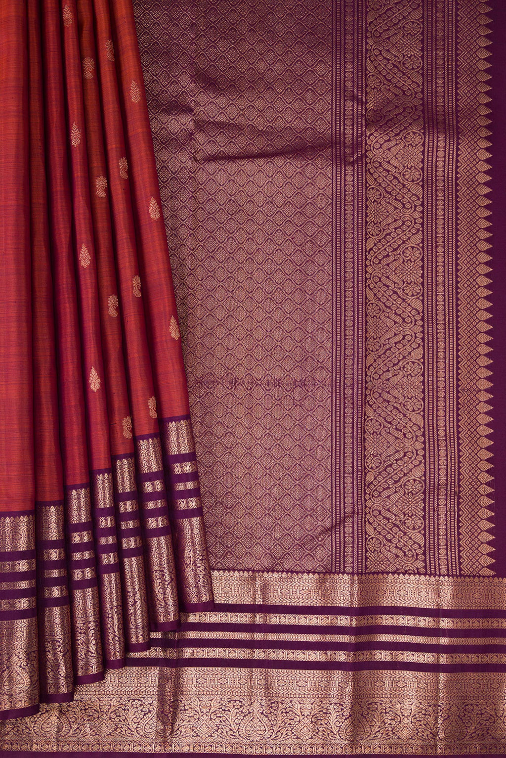 Pleats and pallu of Orange with Magenta Color Kanjivaram Silk Saree with Zari Butta on the body and Zari Border. 