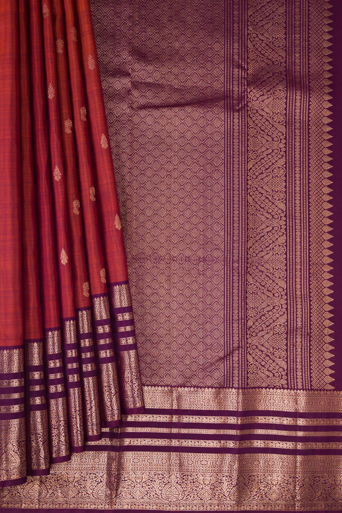 Pleats and pallu of Orange with Magenta Color Kanjivaram Silk Saree with Zari Butta on the body and Zari Border. 