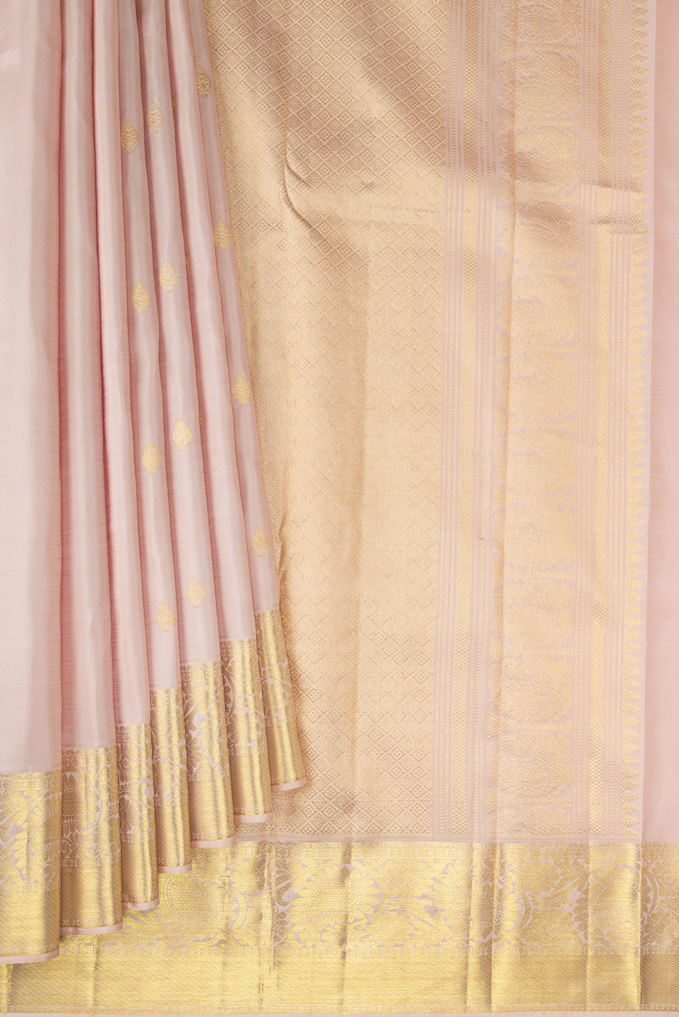 Pleats and pallu of Rose Gold Kanjivaram Silk Saree with Zari Butta on the body and Zari Border. 