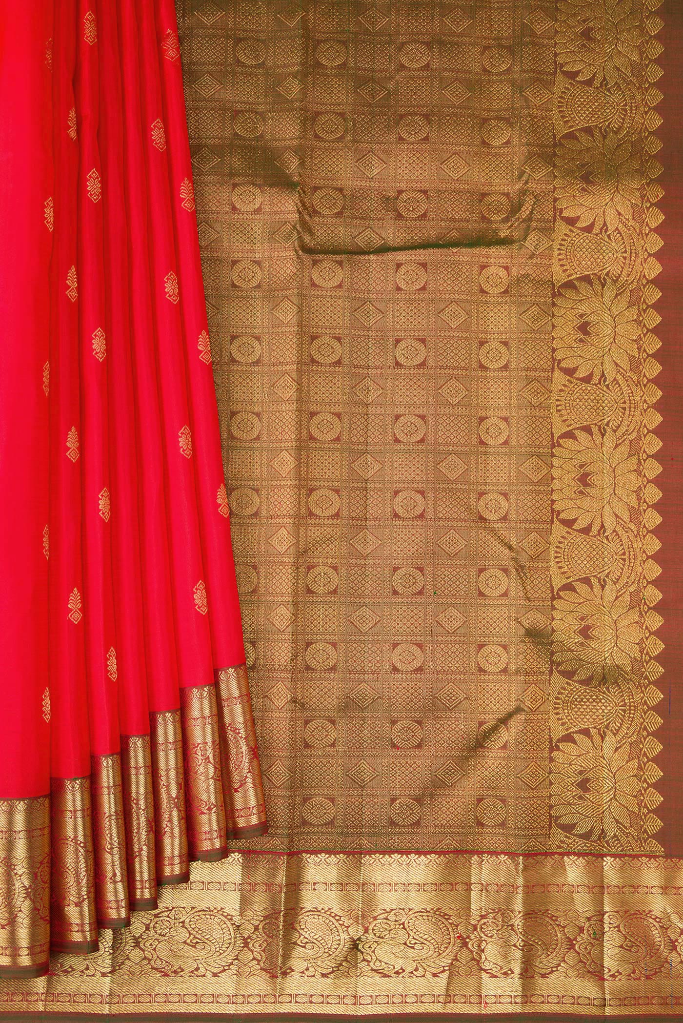 Pleats and pallu of Red Kanjivaram Silk Saree with Zari Butta on the body and Zari Border. 