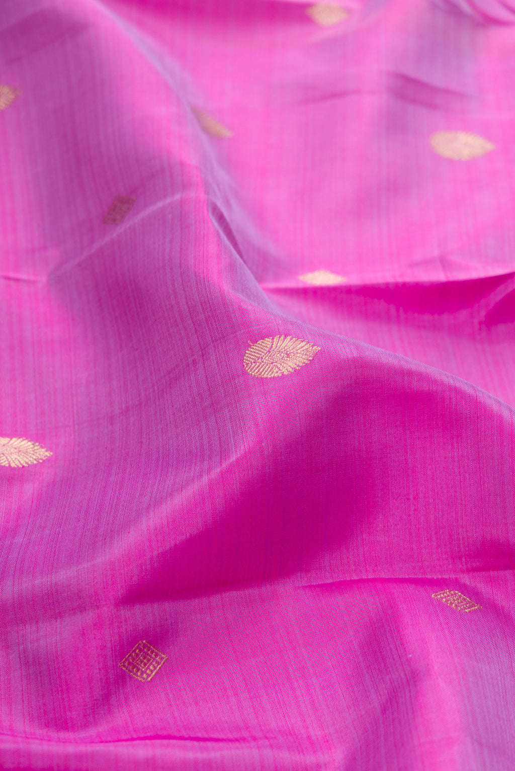 Close up of Lavender Kanchipuram Silk Saree with Zari Butta on the body and Zari Border.  displaying folds