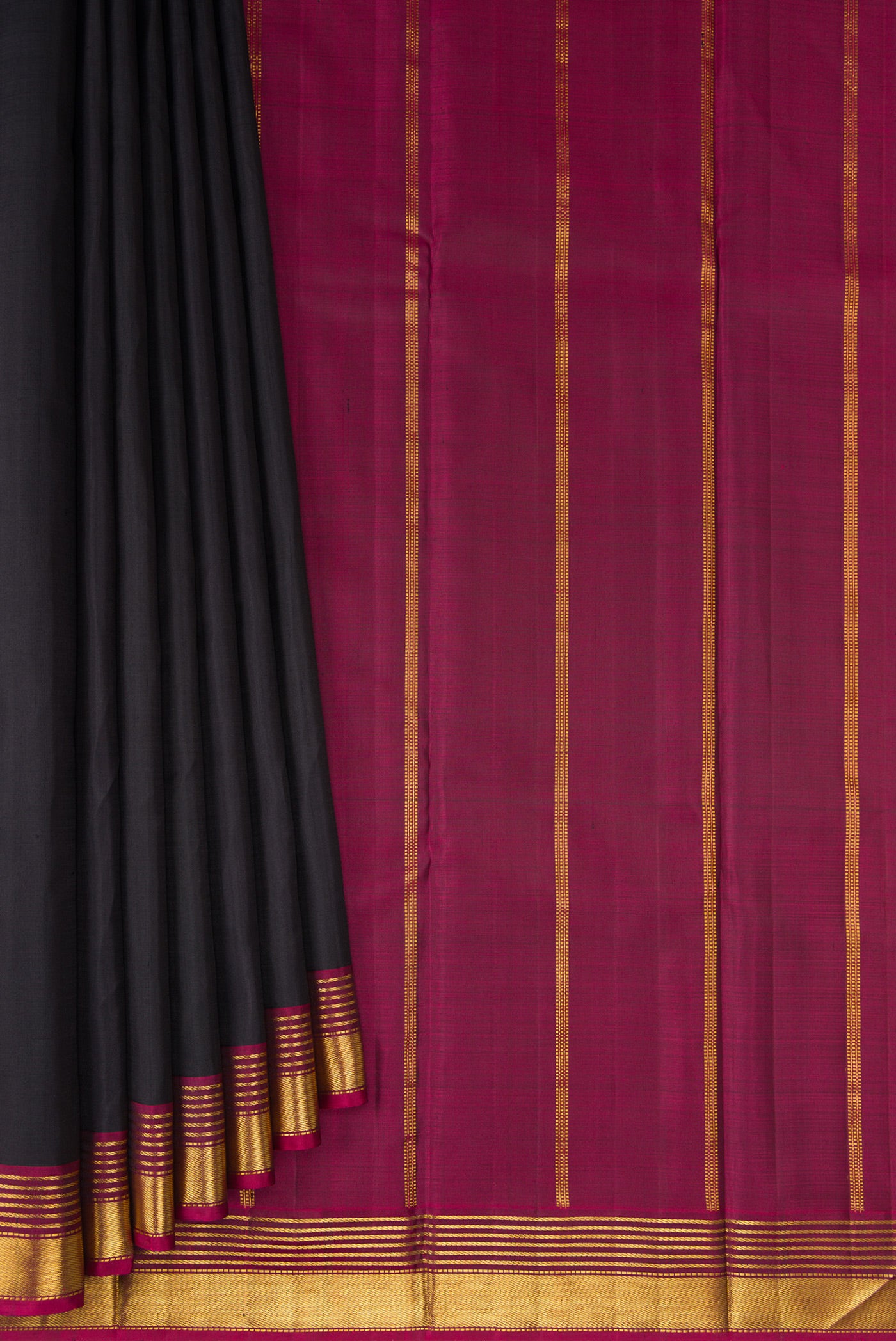 Pleats and pallu of Black Kanjivaram Silk Saree with Plain Body and Zari Border. 