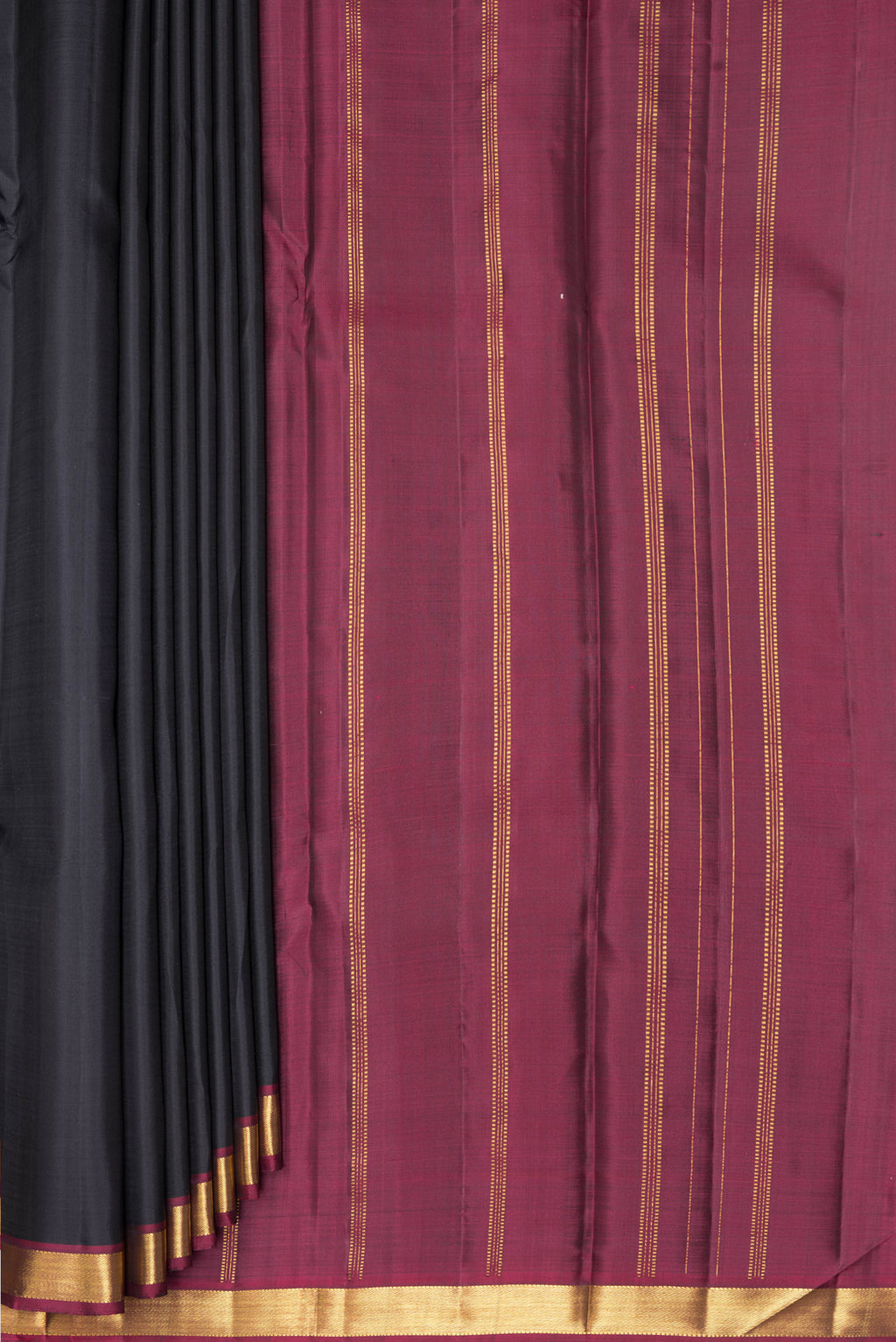 Pleats and pallu of Black Kanjivaram Silk Saree with Plain Body and Zari Border. 