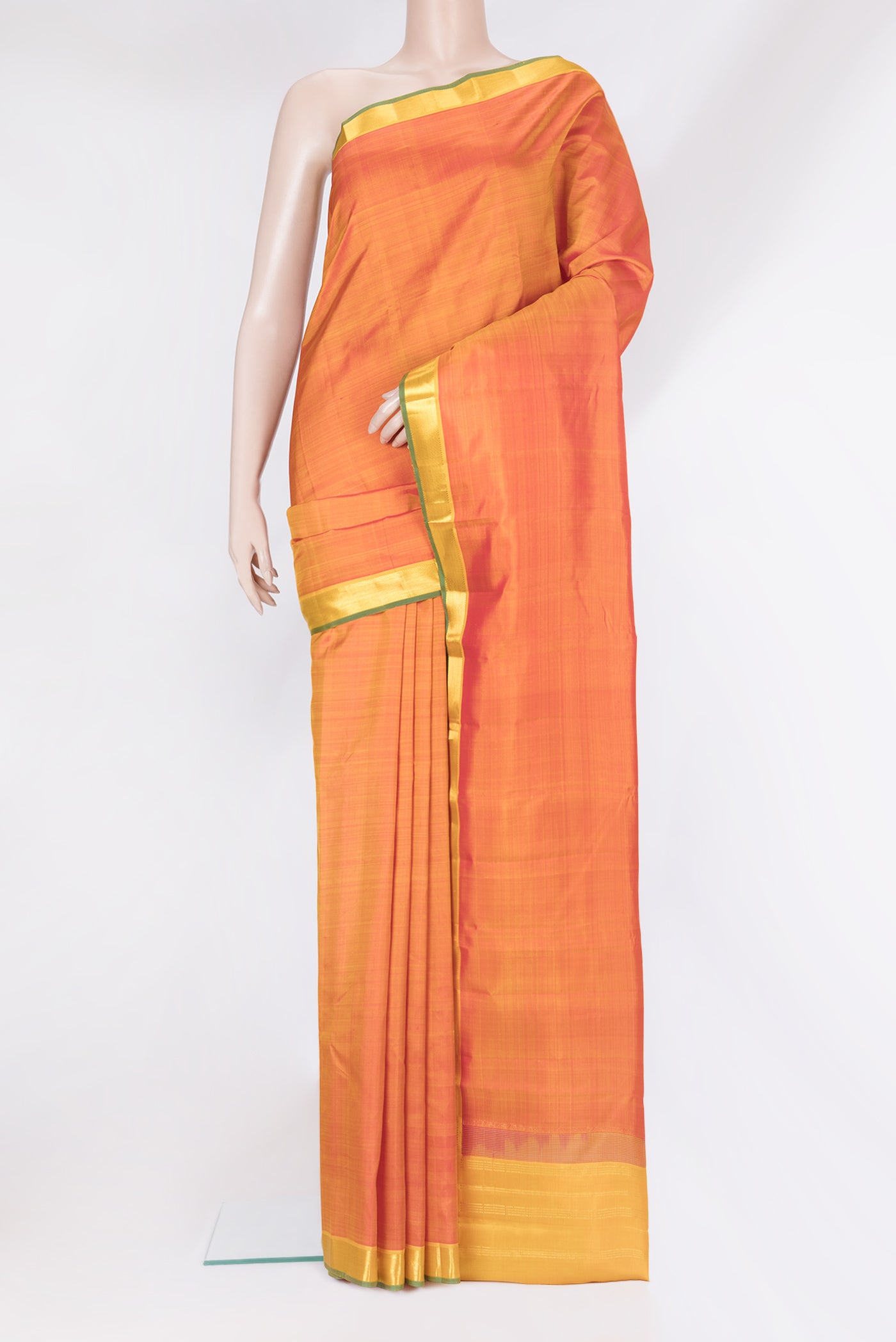 Orange Kanjivaram Silk Saree with Plain Body and Zari Border.  displayed on a mannequin