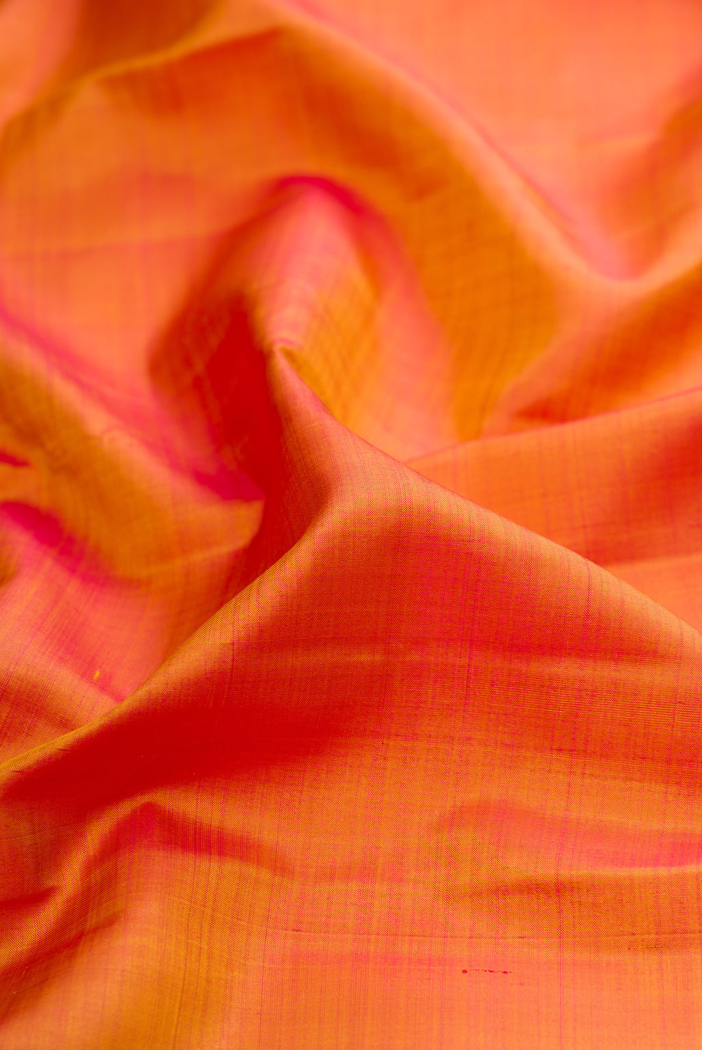 Close up of Mustard Kanjivaram Silk Saree with Plain Body and Zari Border.  displaying folds