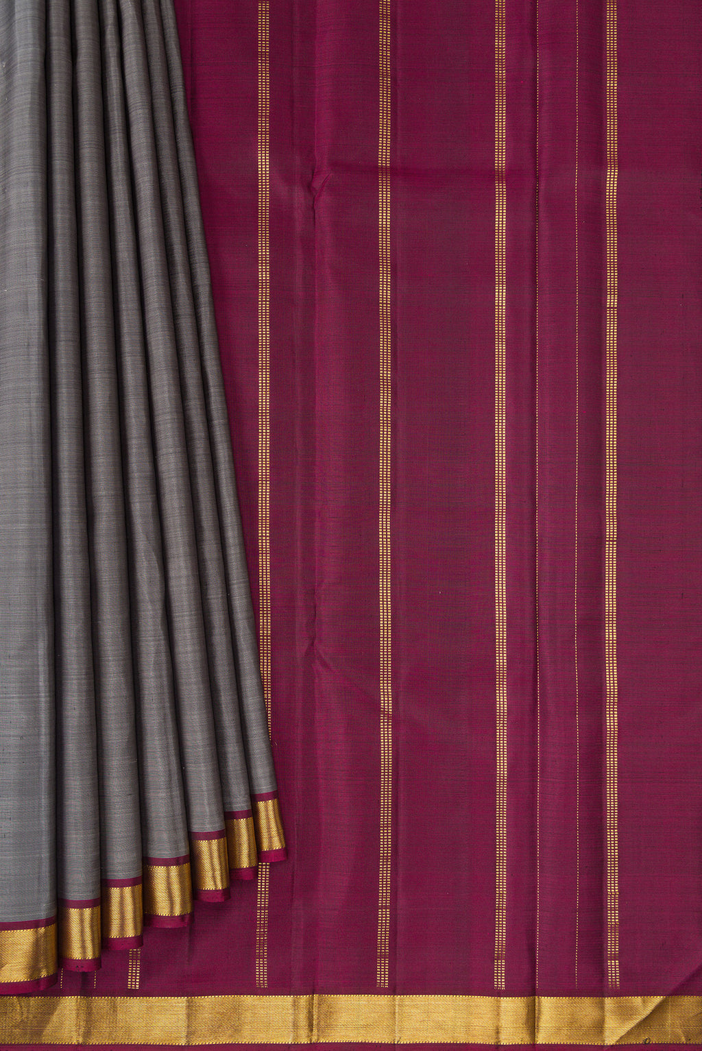 Pleats and pallu of Grey Kanjivaram Silk Saree with Plain Body and Zari Border. 