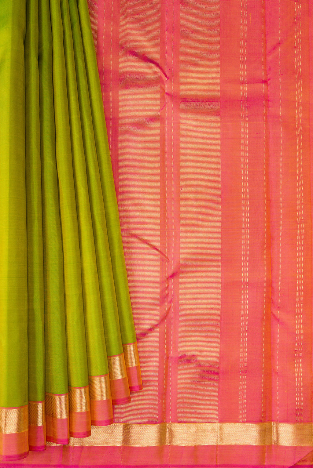 Pleats and pallu of Parrot Green Kanjivaram Silk Saree with Plain Body and Zari Border. 