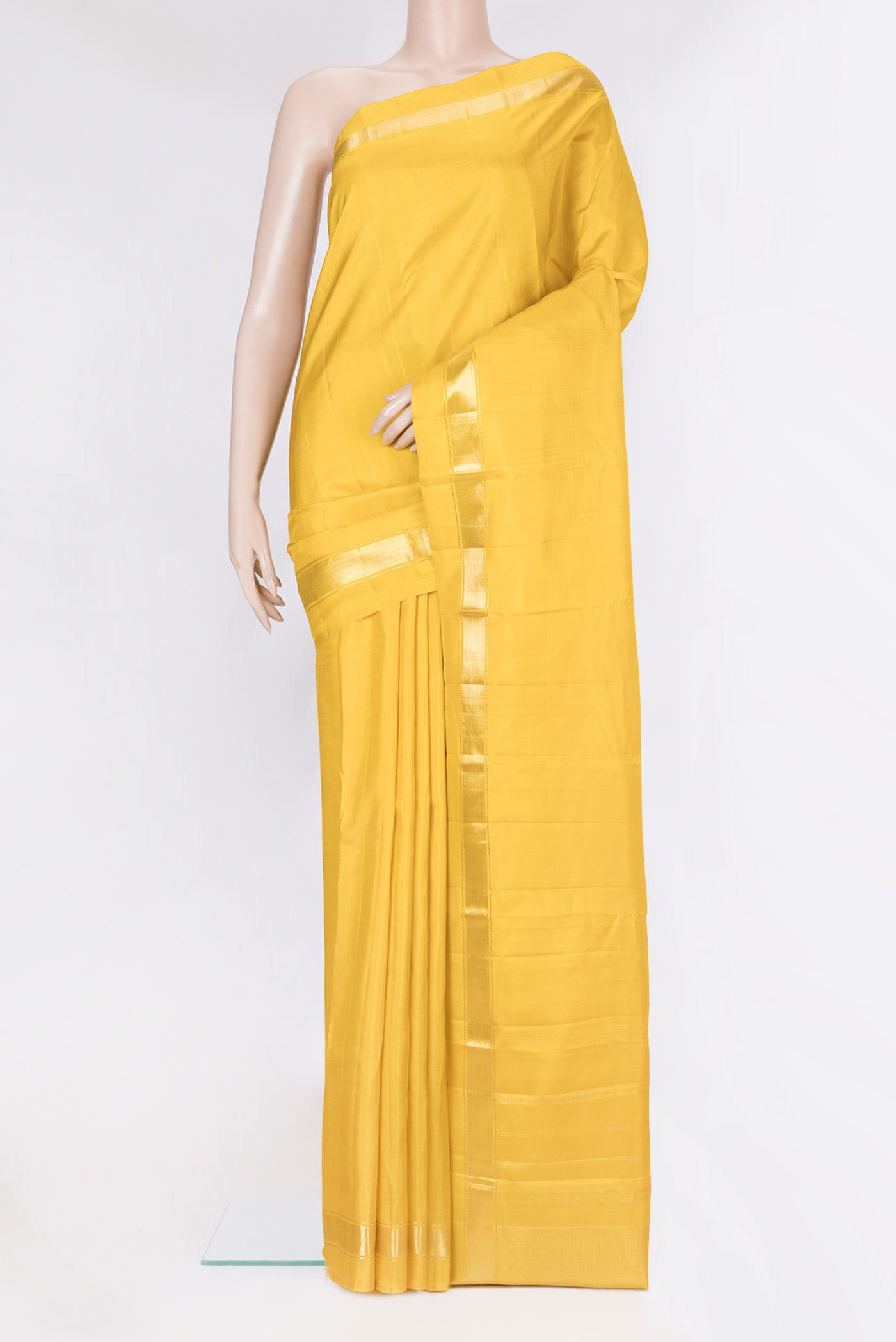 Yellow Kanjivaram Silk Saree with Plain Body and Zari Border.  displayed on a mannequin