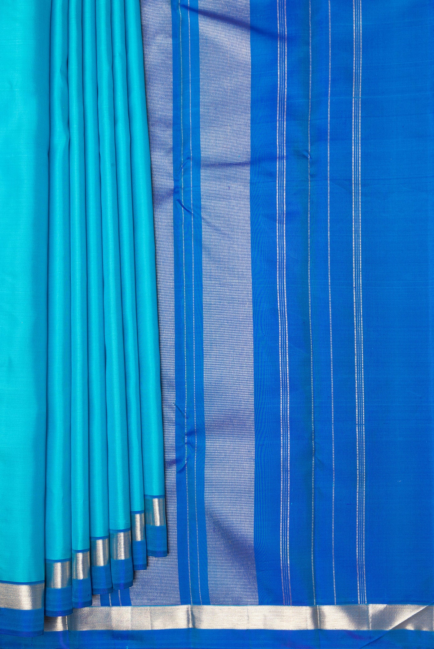 Pleats and pallu of Light Blue Kanjivaram Silk Saree with Plain Body and Zari Border. 