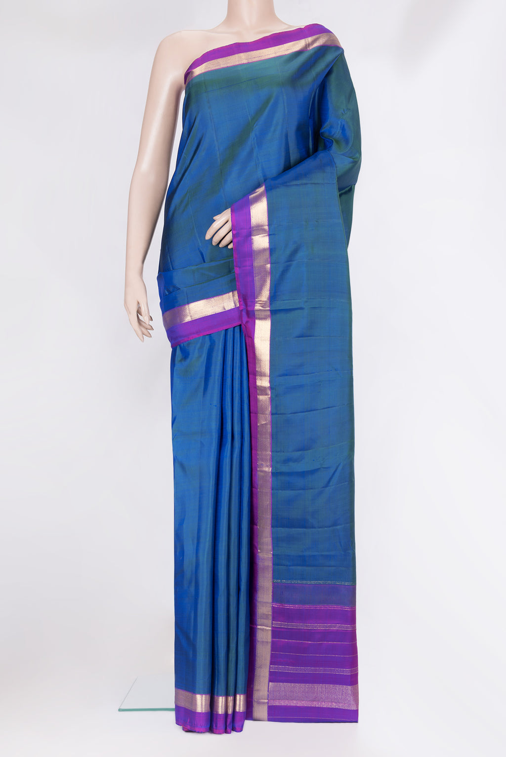 Peacock Blue Kanjivaram Silk Saree with Plain Body and Zari Border.  displayed on a mannequin
