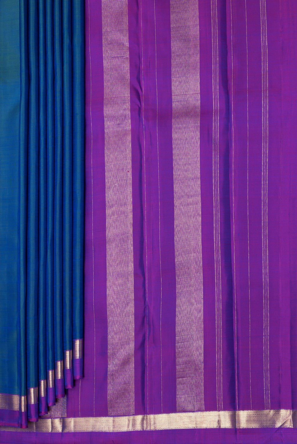 Pleats and pallu of Peacock Blue Kanjivaram Silk Saree with Plain Body and Zari Border. 