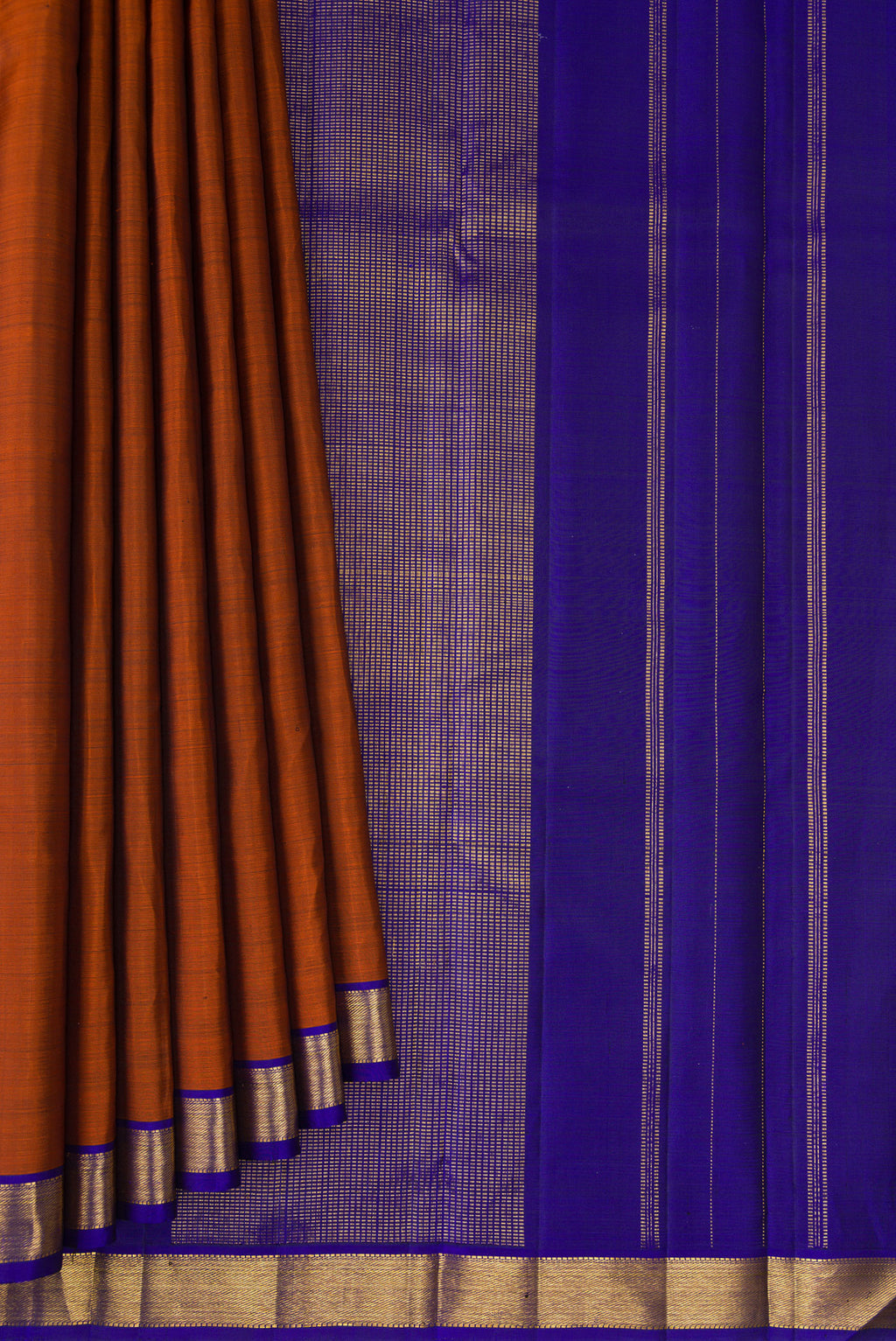 Pleats and pallu of Rust Kanjivaram Silk Saree with Plain Body and Zari Border. 