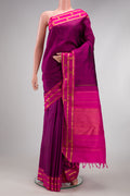 Purple Kanchipuram Silk Saree with Plain Body and Zari Border.  displayed on a mannequin